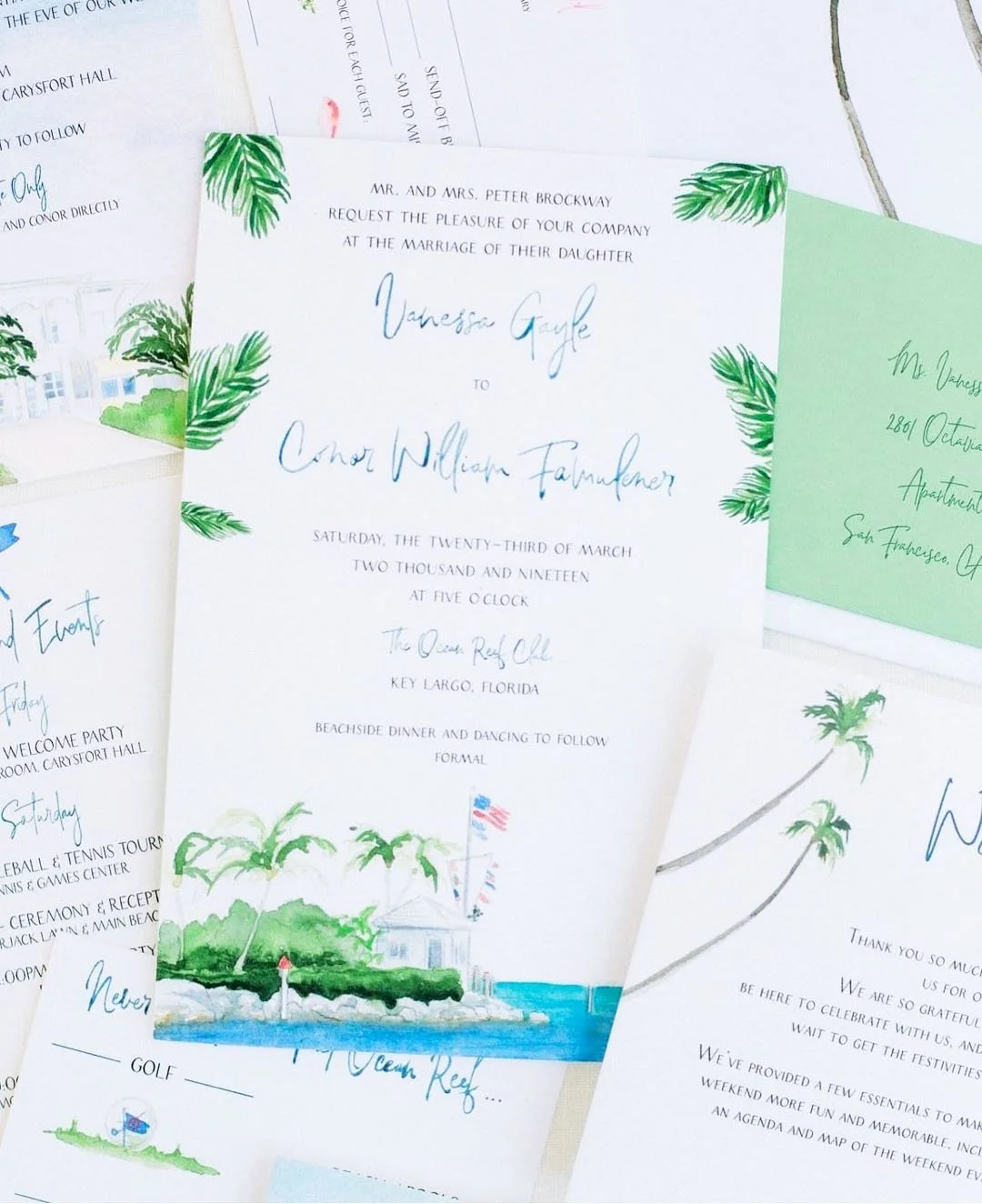 Wedding invitation with a tropical theme, featuring palm leaves, a lighthouse, and an American flag, inviting guests to a wedding at The Ocean Reef Club in Key Largo, Florida.