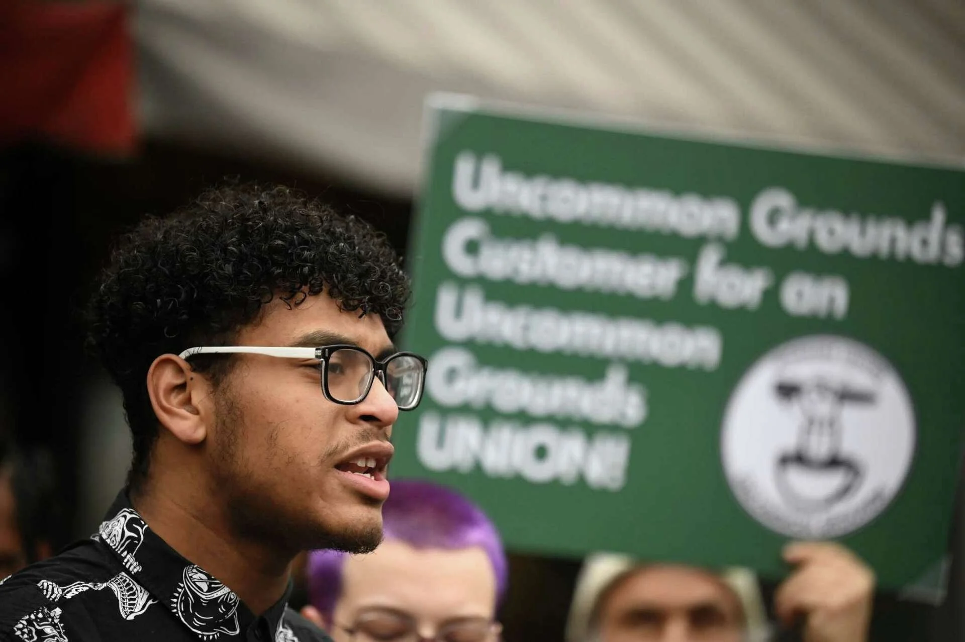 A photo of Justin Bessette at a Press Conference Uncommon Workers held