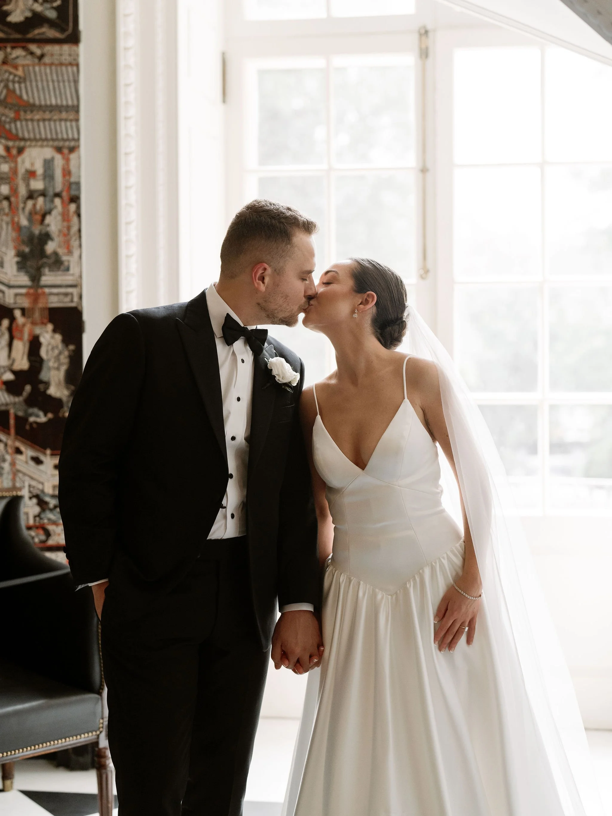 Bride and groom portrait at Swan House Atlanta with historic estate architecture and romantic garden setting 
