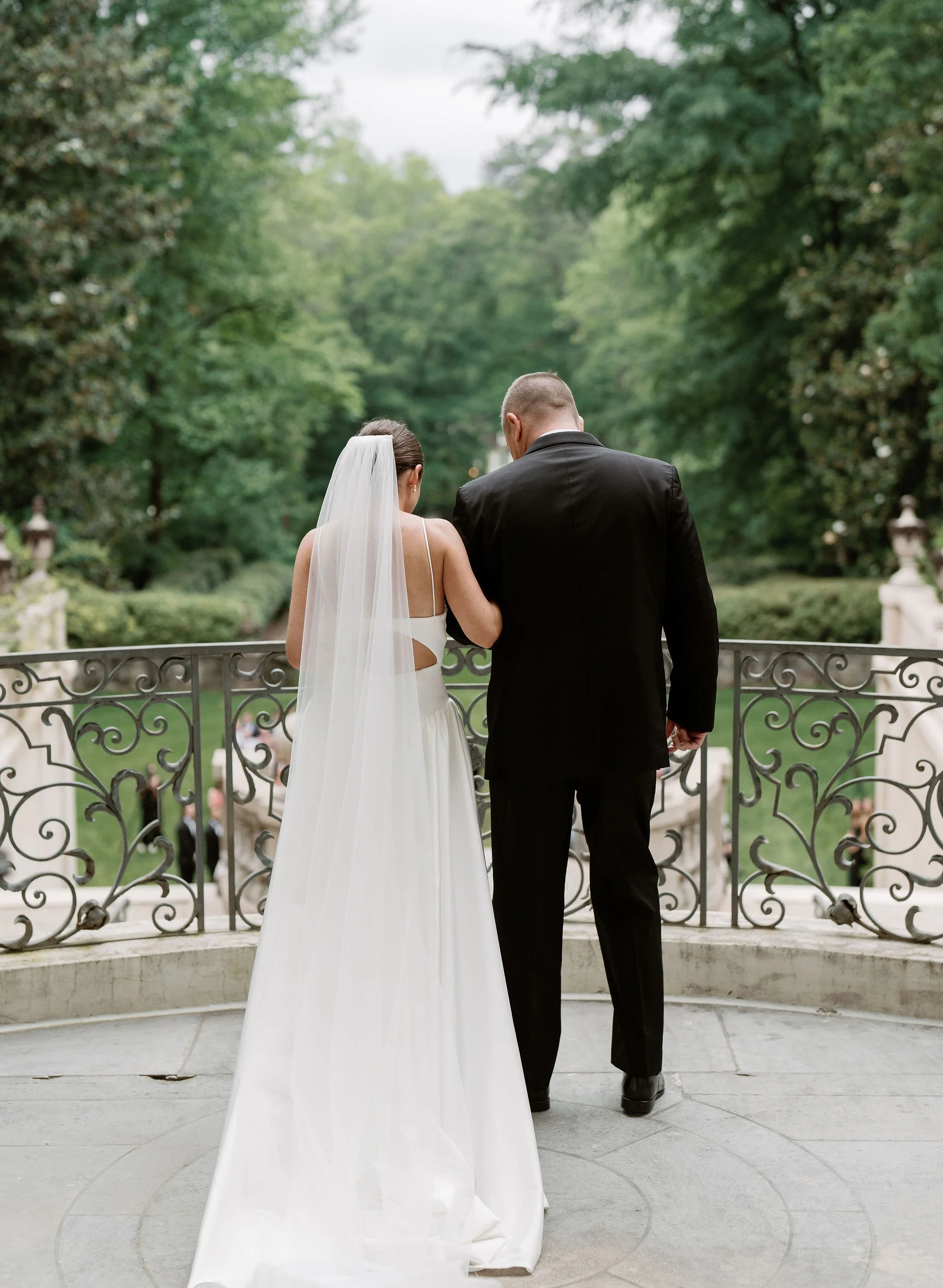 Outdoor wedding ceremony at Swan House Atlanta History Center with elegant garden and estate backdrop