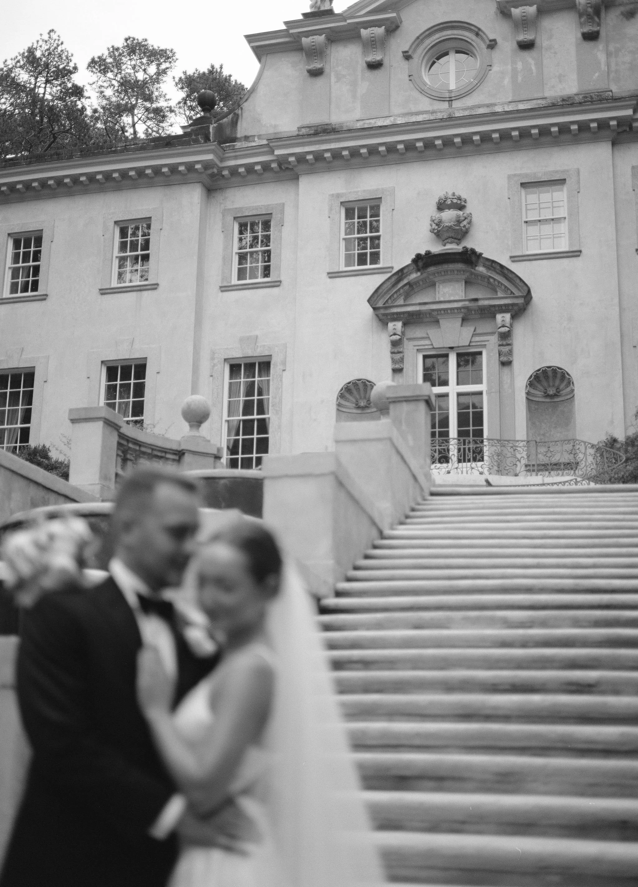 Bride and groom portrait at Swan House Atlanta with historic estate architecture and romantic garden setting 