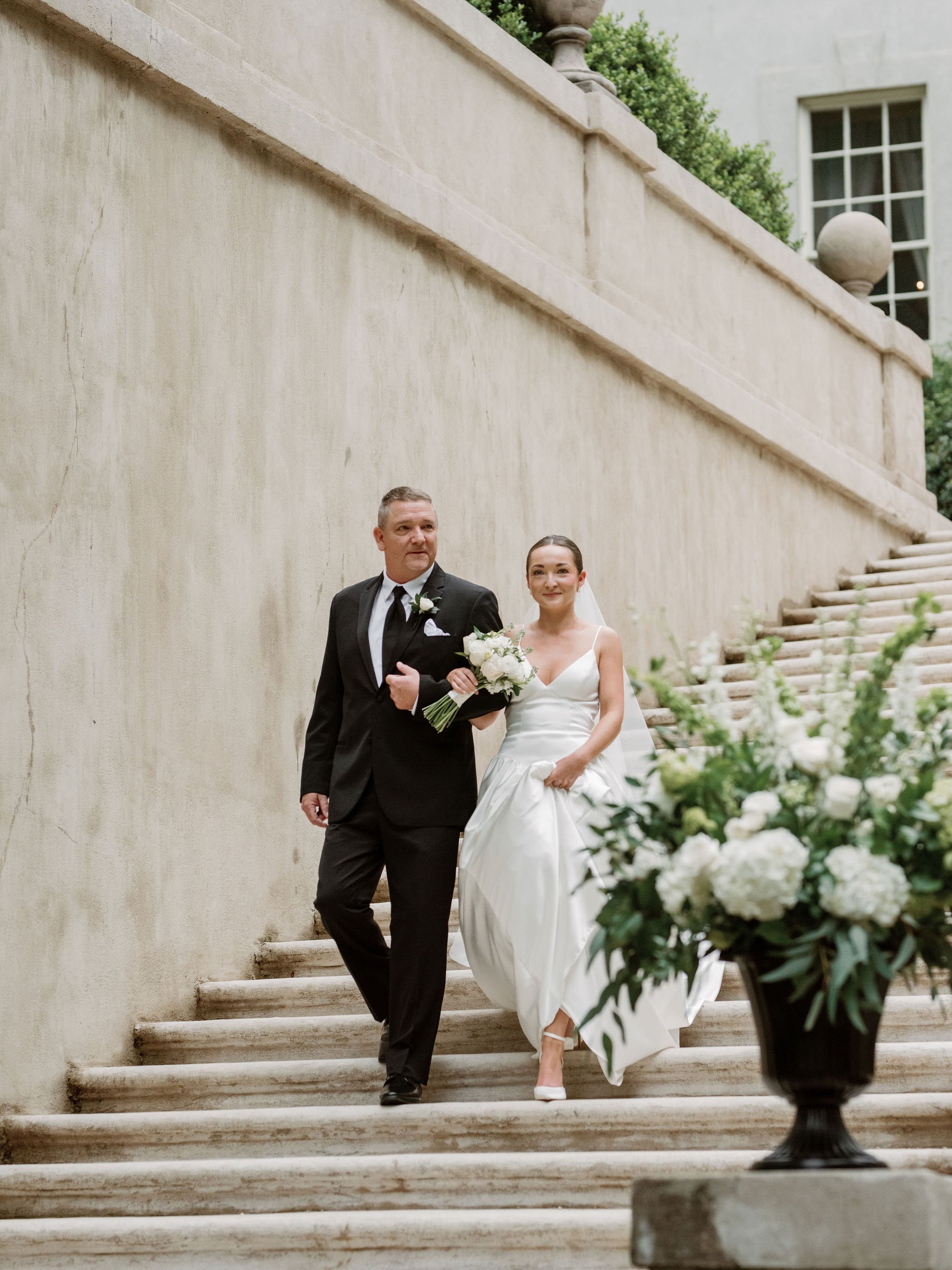 Outdoor wedding ceremony at Swan House Atlanta History Center with elegant garden and estate backdrop