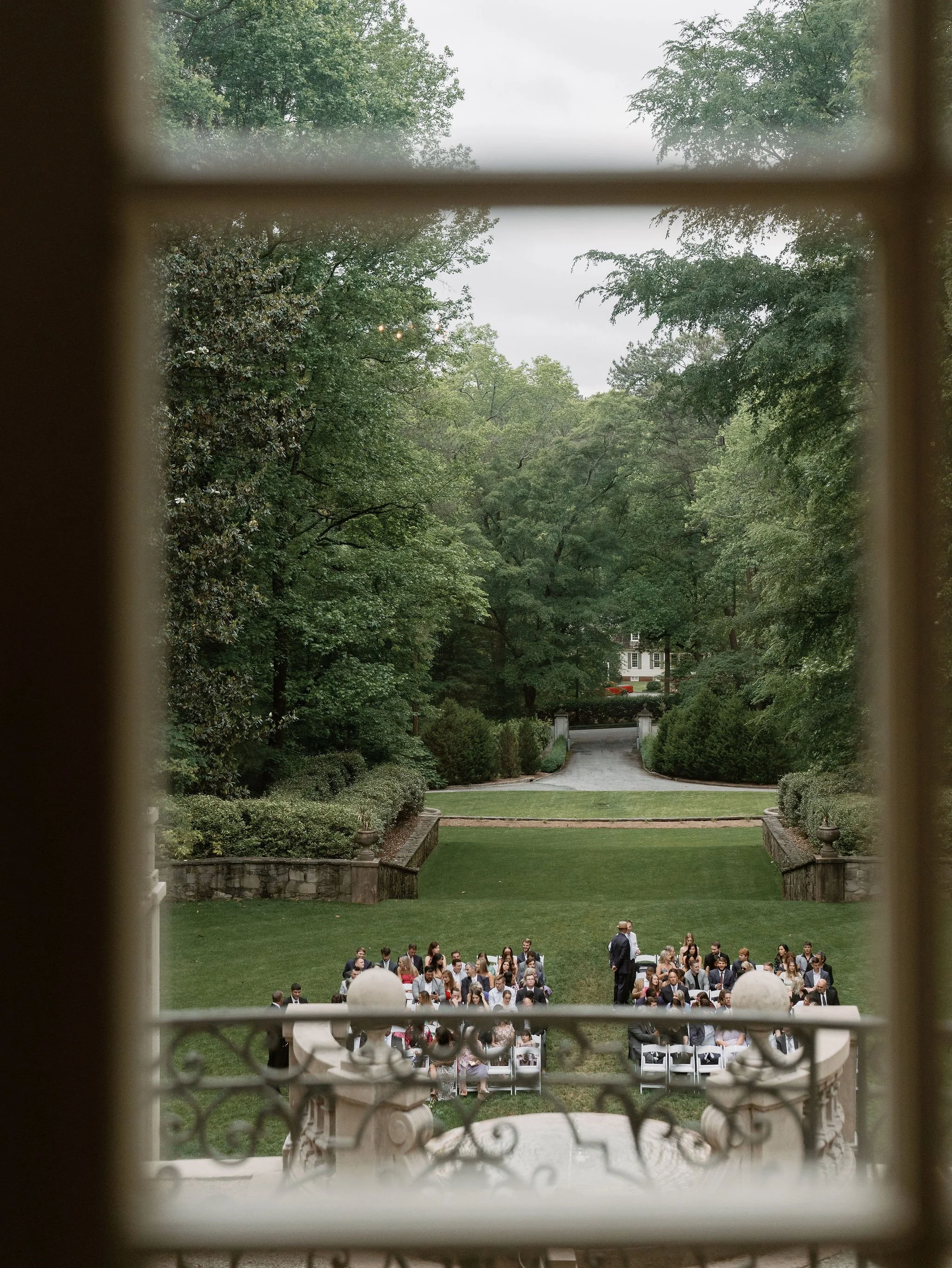 Outdoor wedding ceremony at Swan House Atlanta History Center with elegant garden and estate backdrop