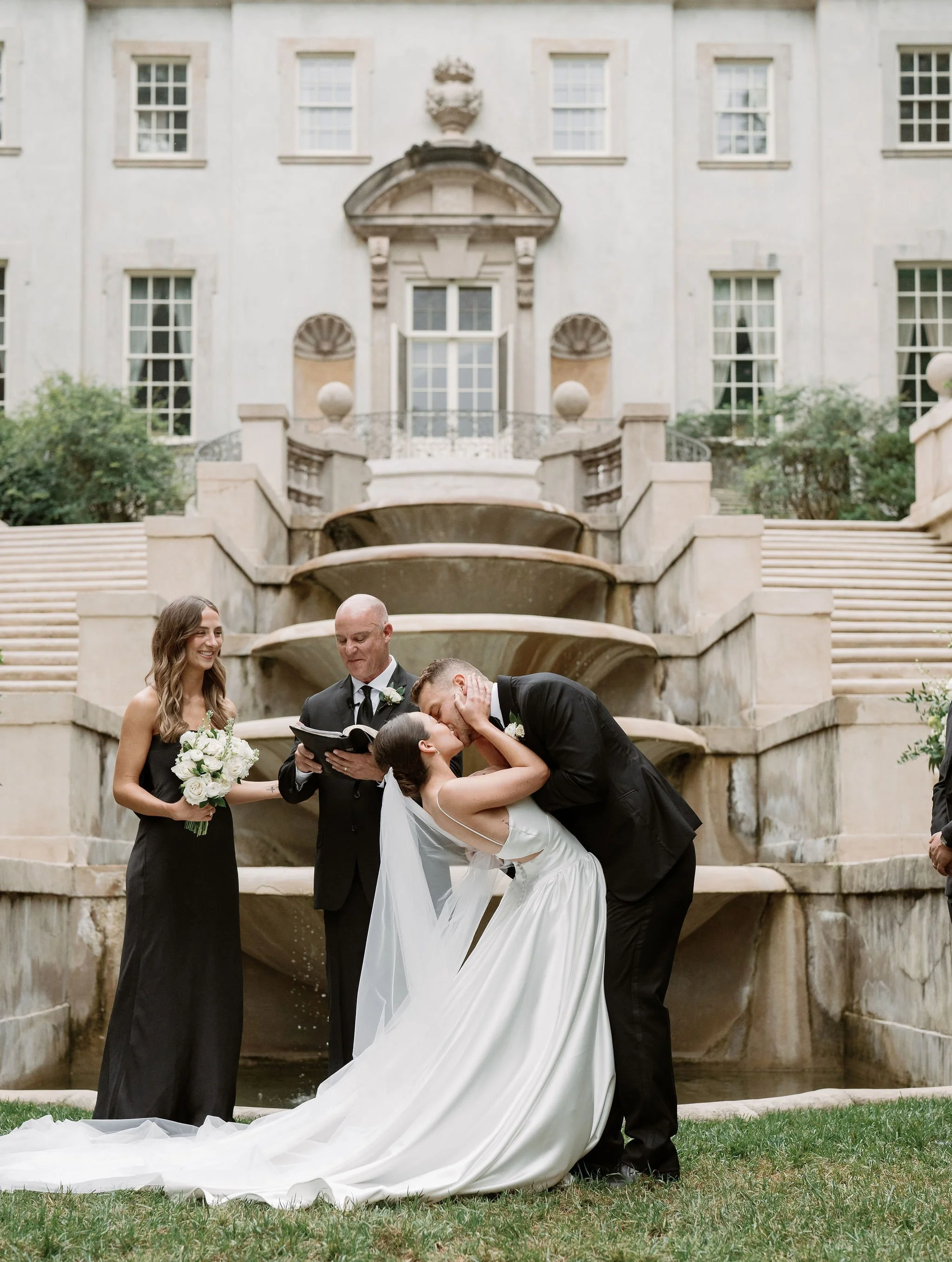 Outdoor wedding ceremony at Swan House Atlanta History Center with elegant garden and estate backdrop