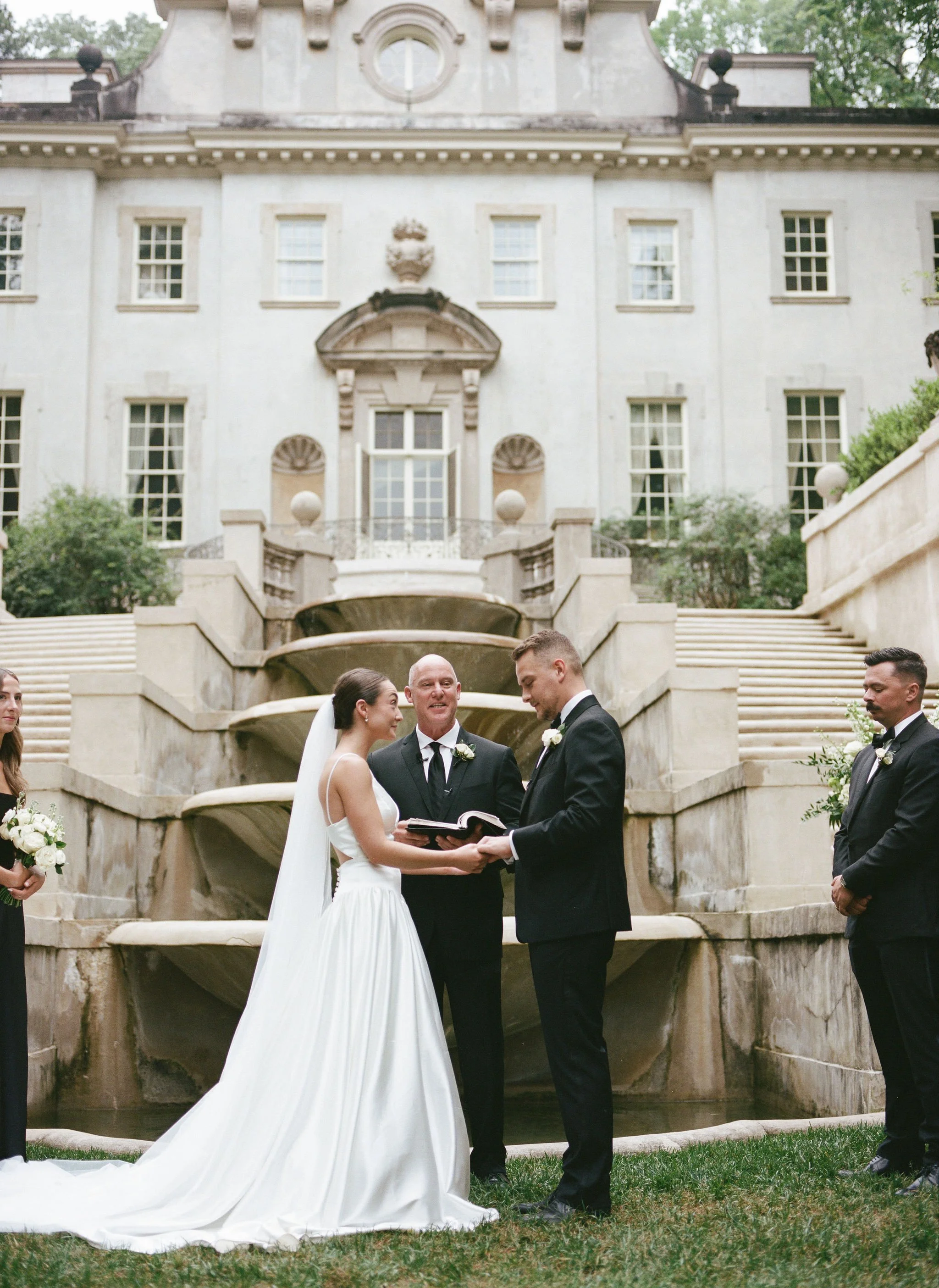 Outdoor wedding ceremony at Swan House Atlanta History Center with elegant garden and estate backdrop