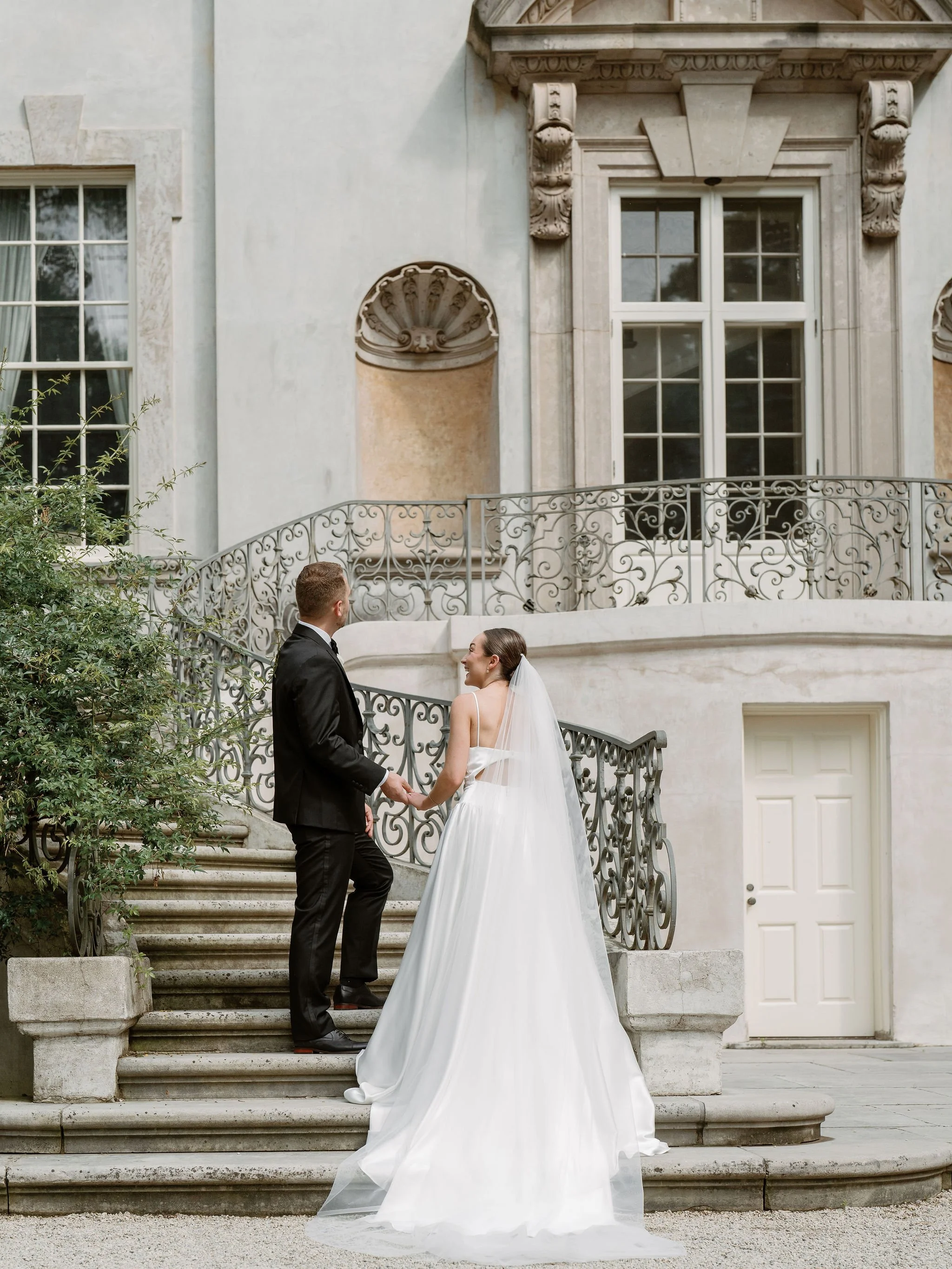 Bride and groom portrait at Swan House Atlanta with historic estate architecture and romantic garden setting 
