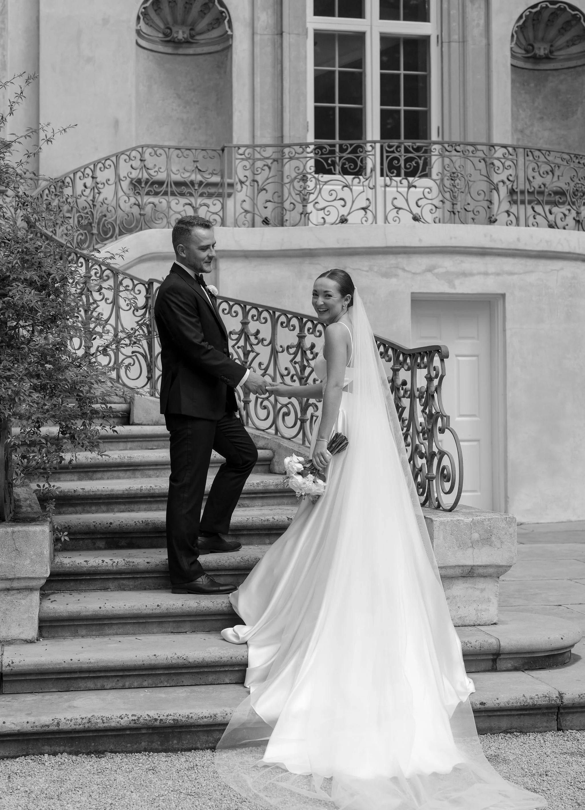 Bride and groom portrait at Swan House Atlanta with historic estate architecture and romantic garden setting 