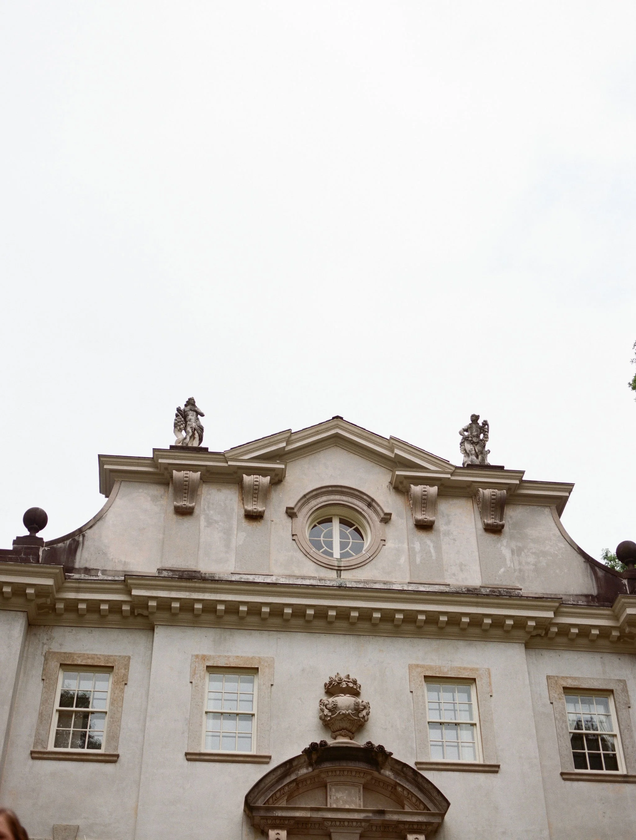 Outdoor wedding ceremony at Swan House Atlanta History Center with elegant garden and estate backdrop.