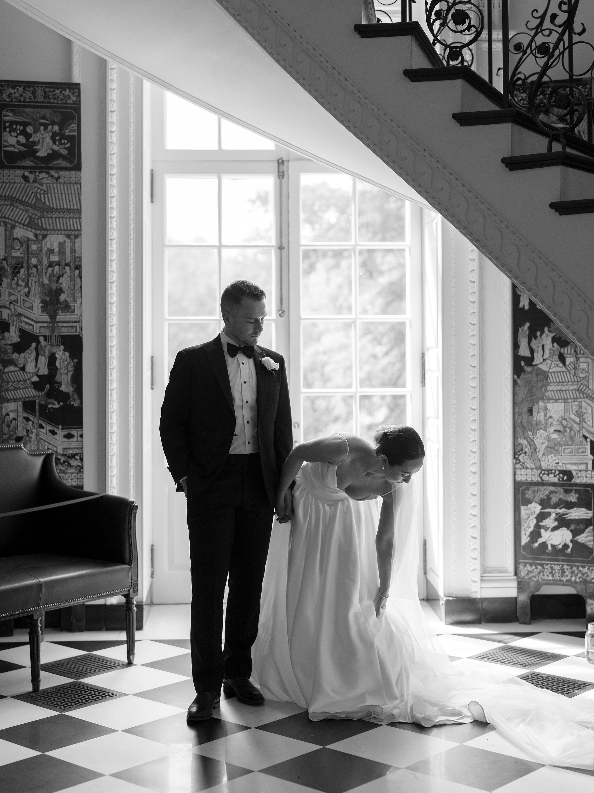Bride and groom portrait at Swan House Atlanta with historic estate architecture and romantic garden setting 