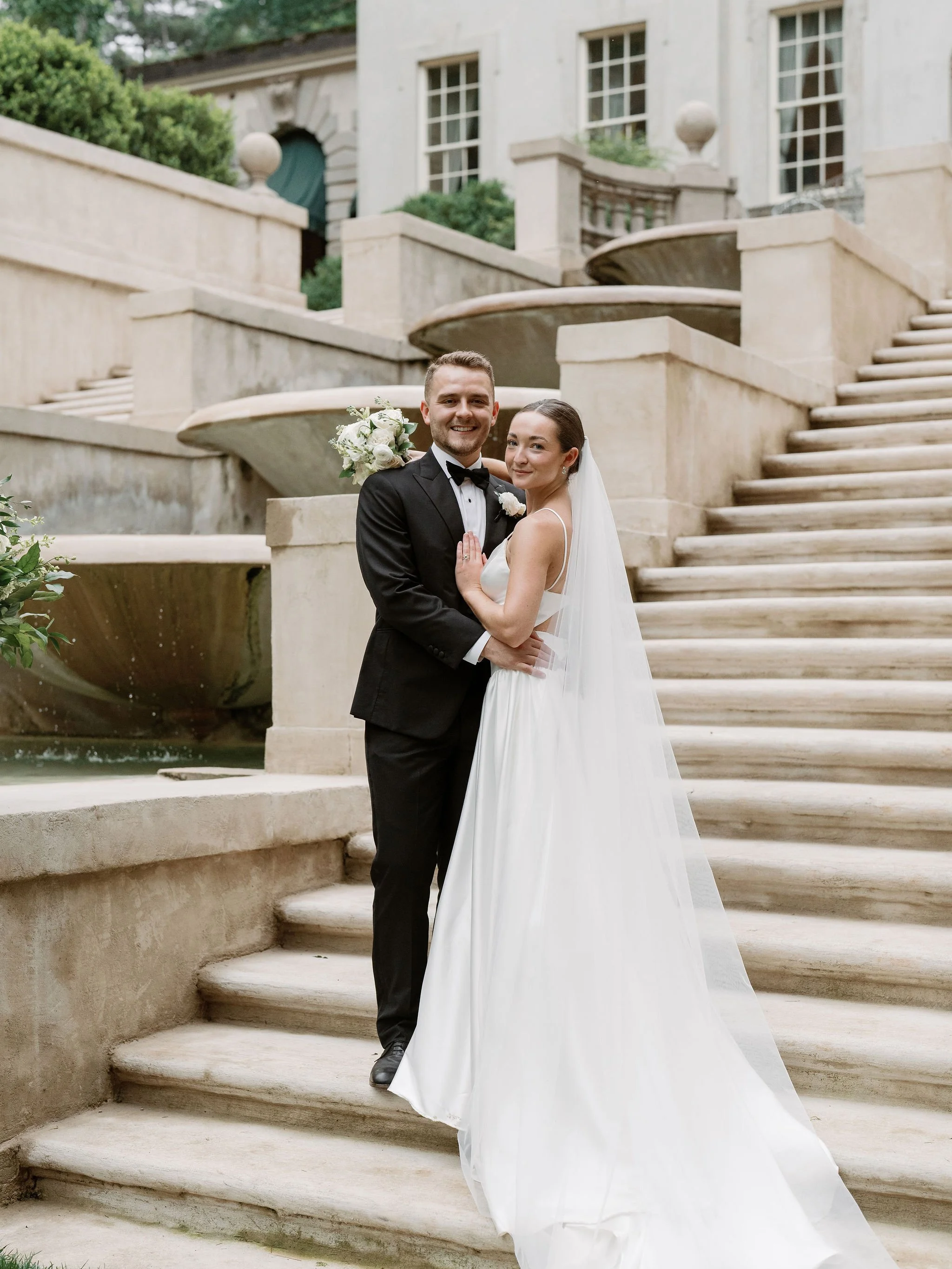 Bride and groom portrait at Swan House Atlanta with historic estate architecture and romantic garden setting 