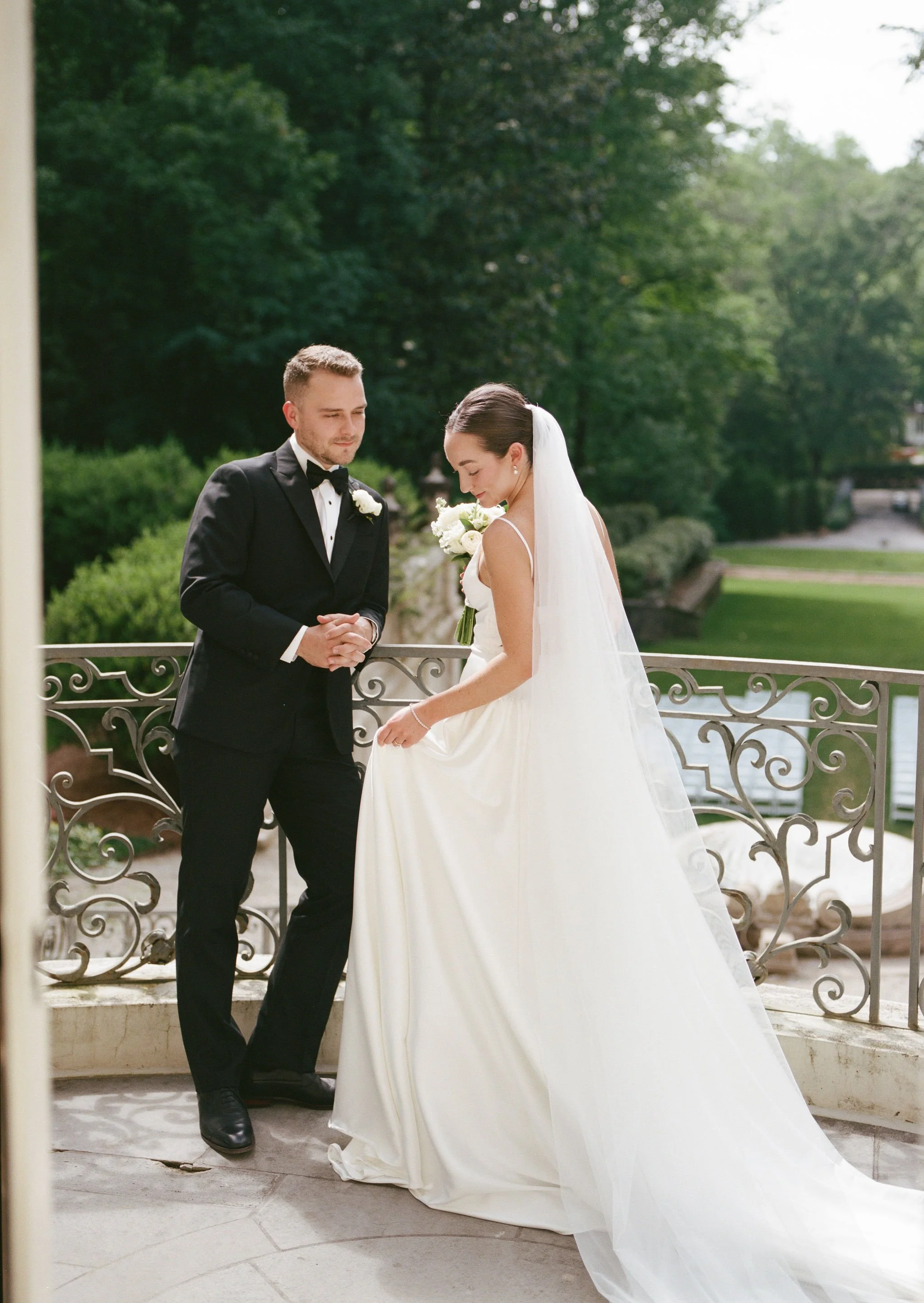 Bride and groom portrait at Swan House Atlanta with historic estate architecture and romantic garden setting 