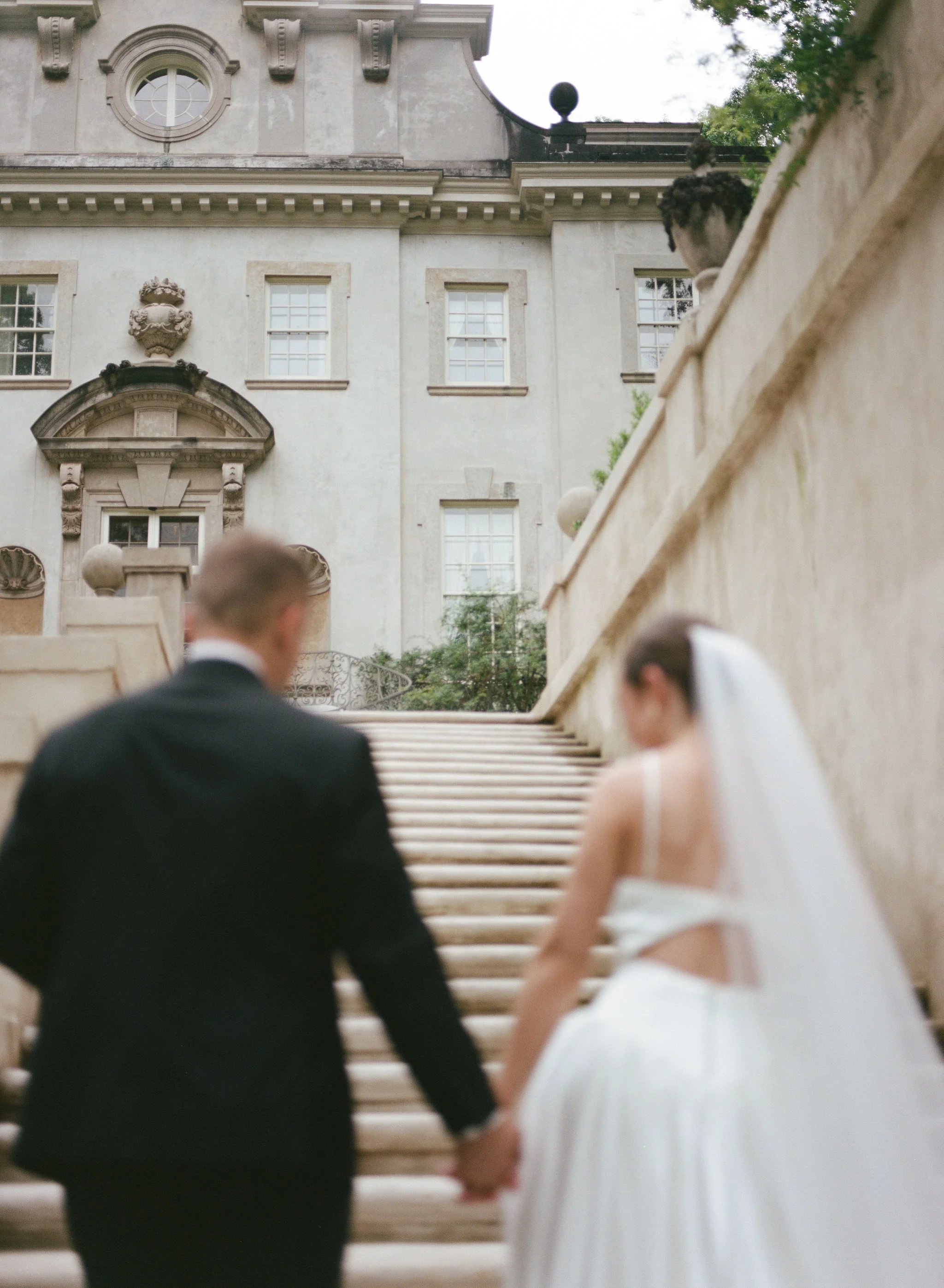 Bride and groom portrait at Swan House Atlanta with historic estate architecture and romantic garden setting 