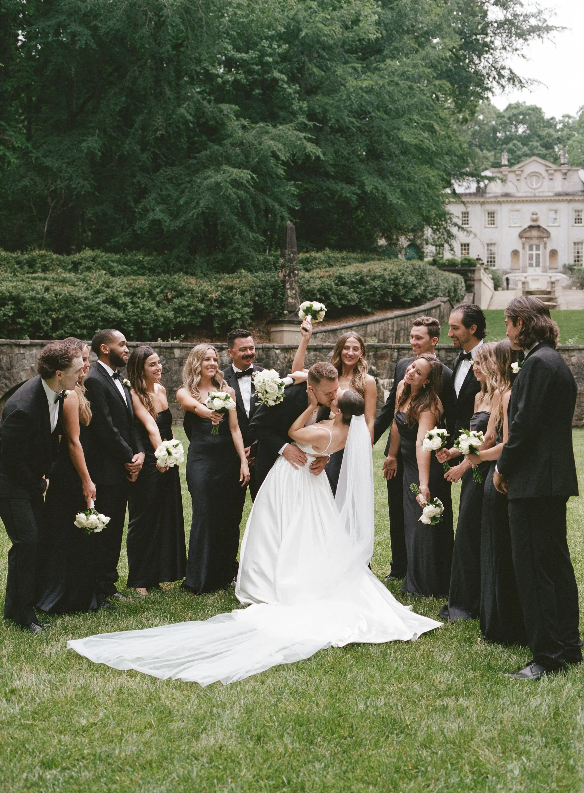 Bride and groom walking through Swan House gardens in Atlanta Georgia during romantic wedding portraits