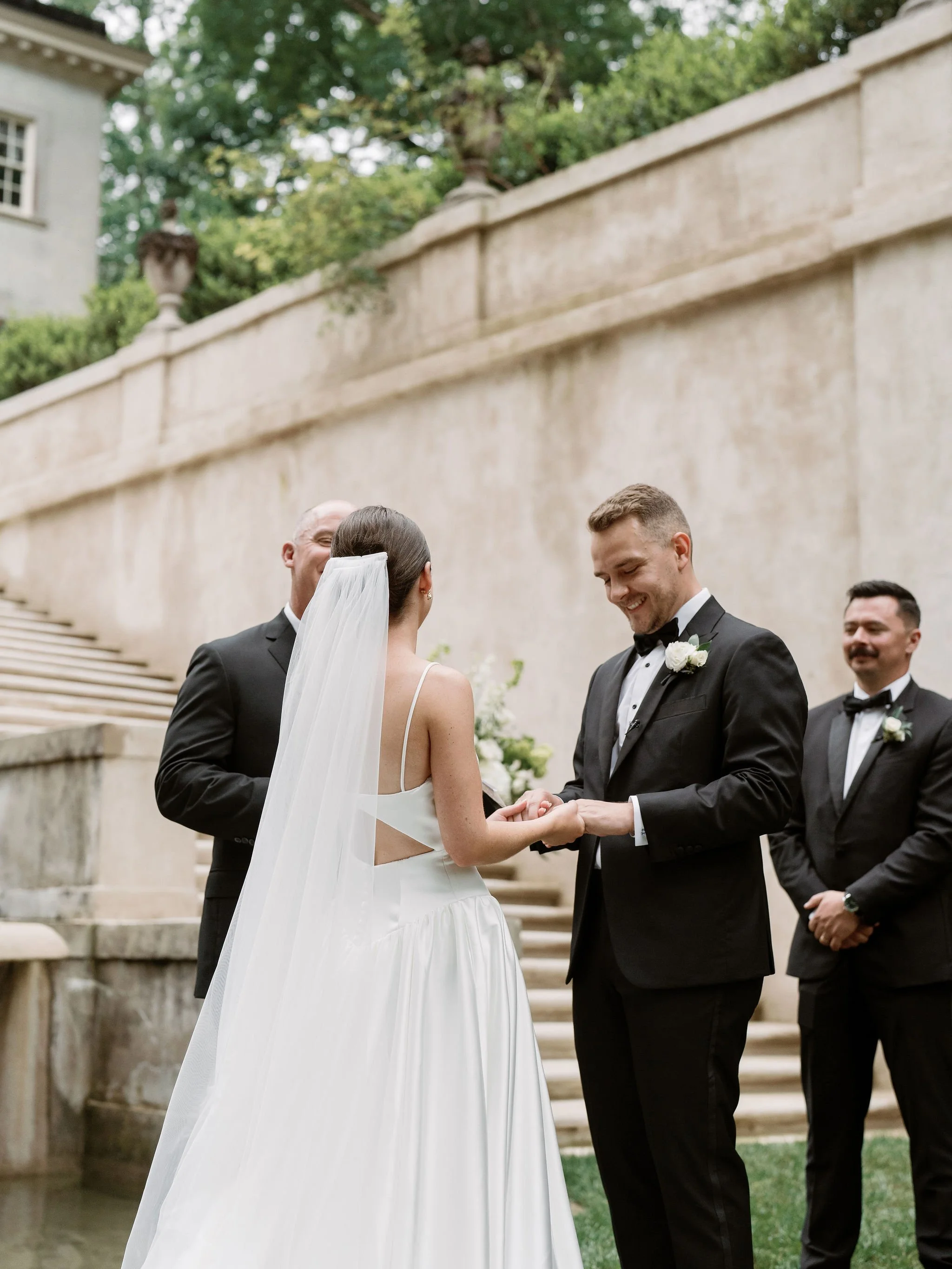 Outdoor wedding ceremony at Swan House Atlanta History Center with elegant garden and estate backdrop