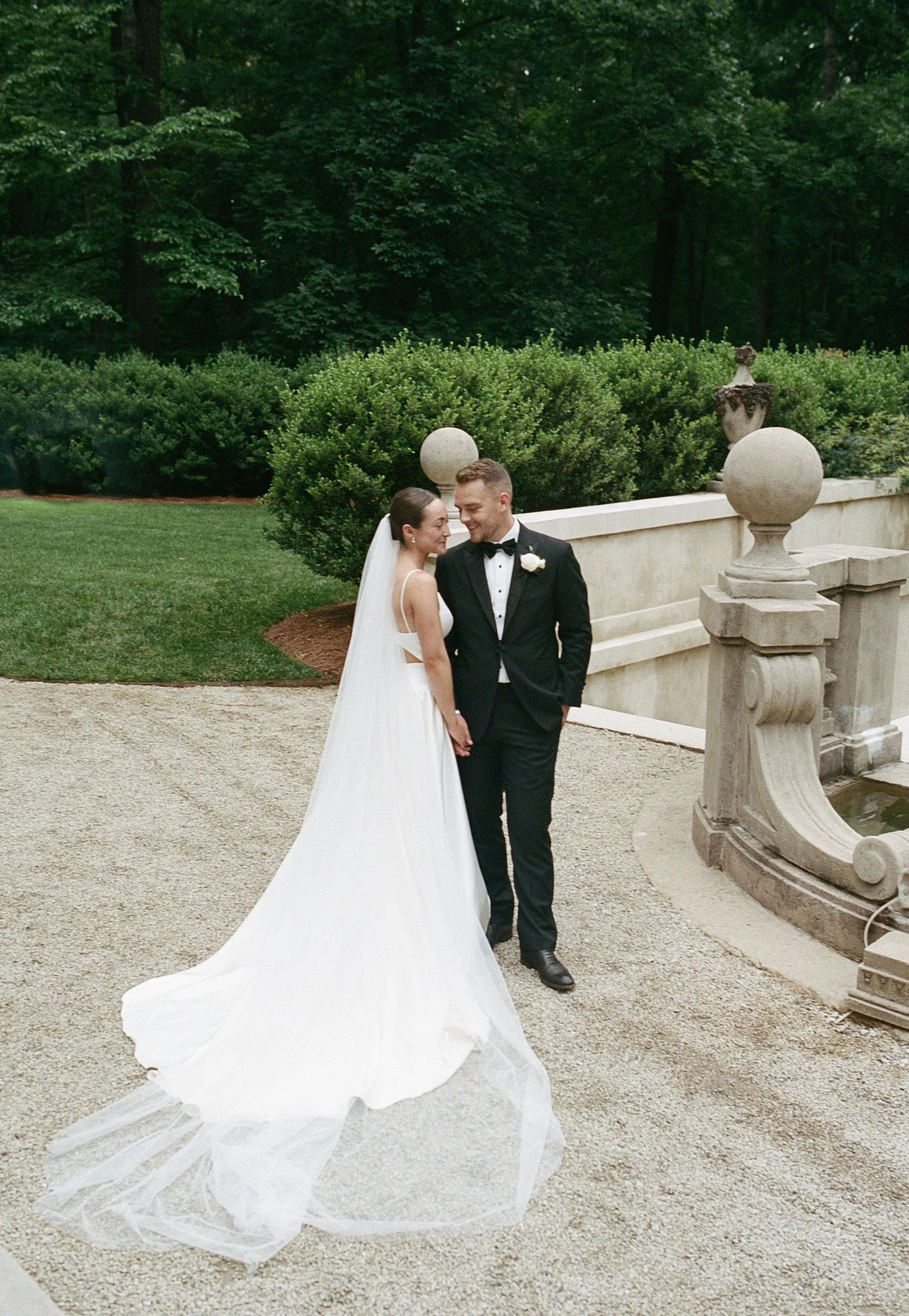Bride and groom portrait at Swan House Atlanta with historic estate architecture and romantic garden setting 