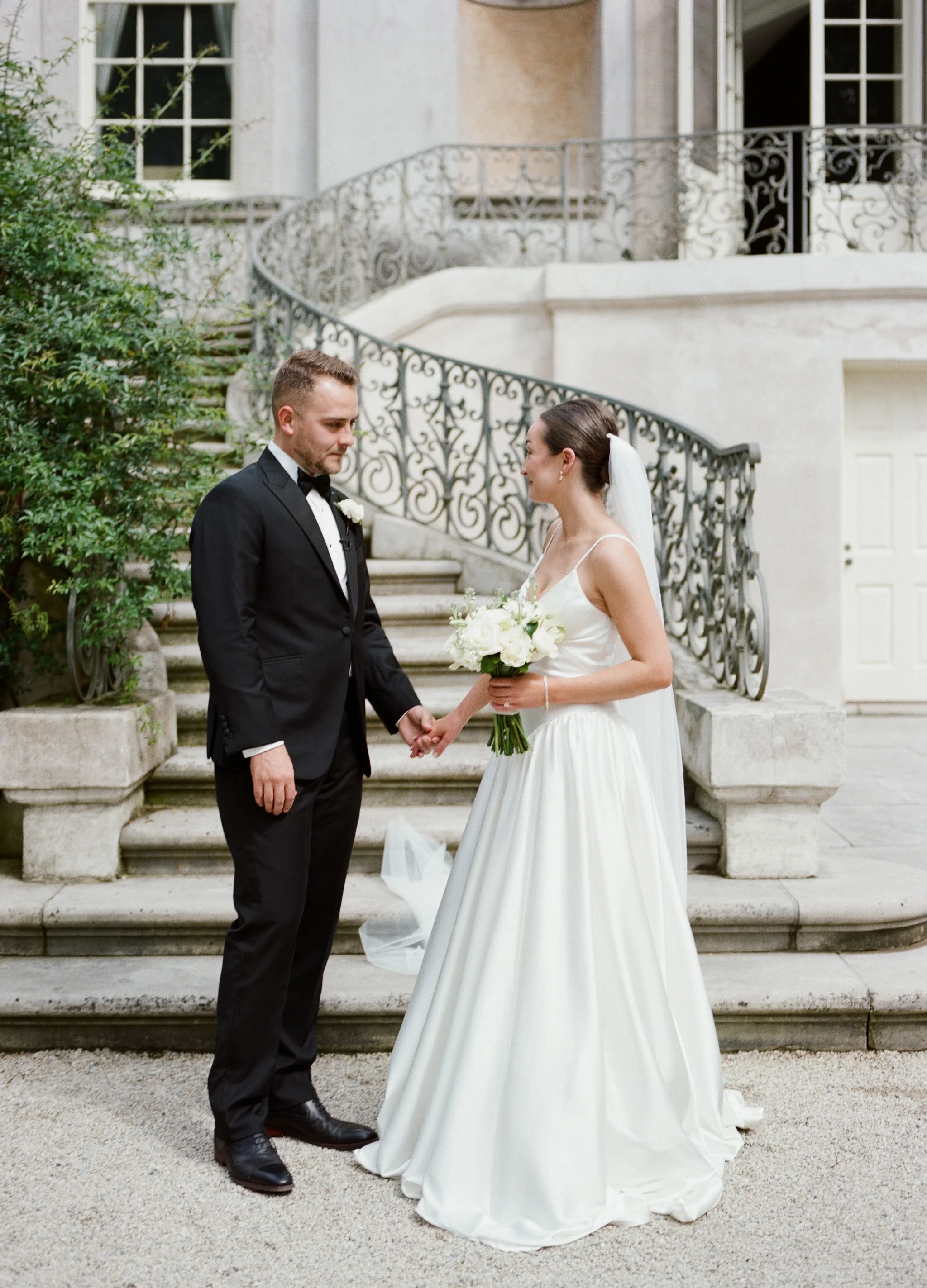 Bride and groom portrait at Swan House Atlanta with historic estate architecture and romantic garden setting 