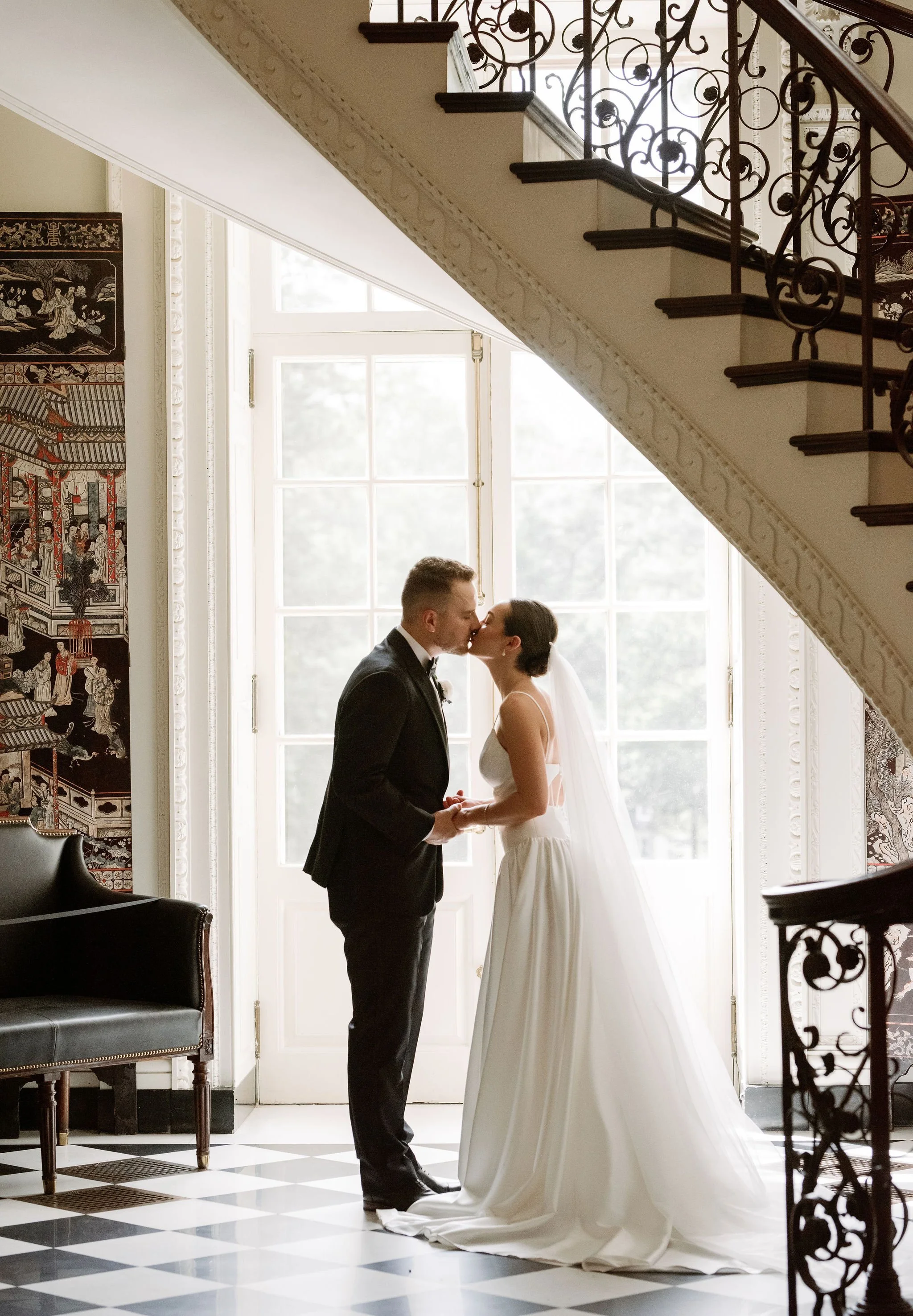 Bride and groom portrait at Swan House Atlanta with historic estate architecture and romantic garden setting 