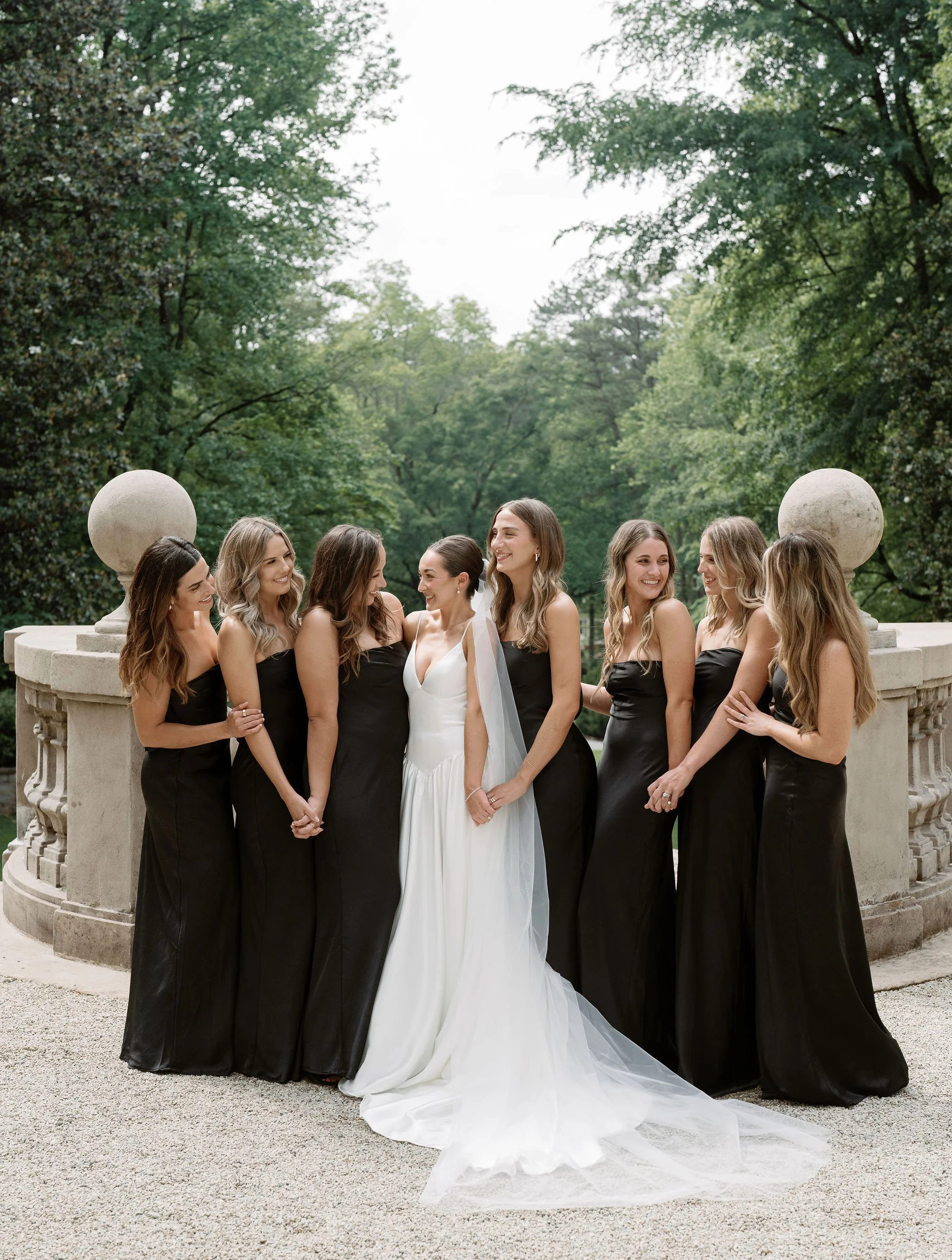 Bride and groom walking through Swan House gardens in Atlanta Georgia during romantic wedding portraits