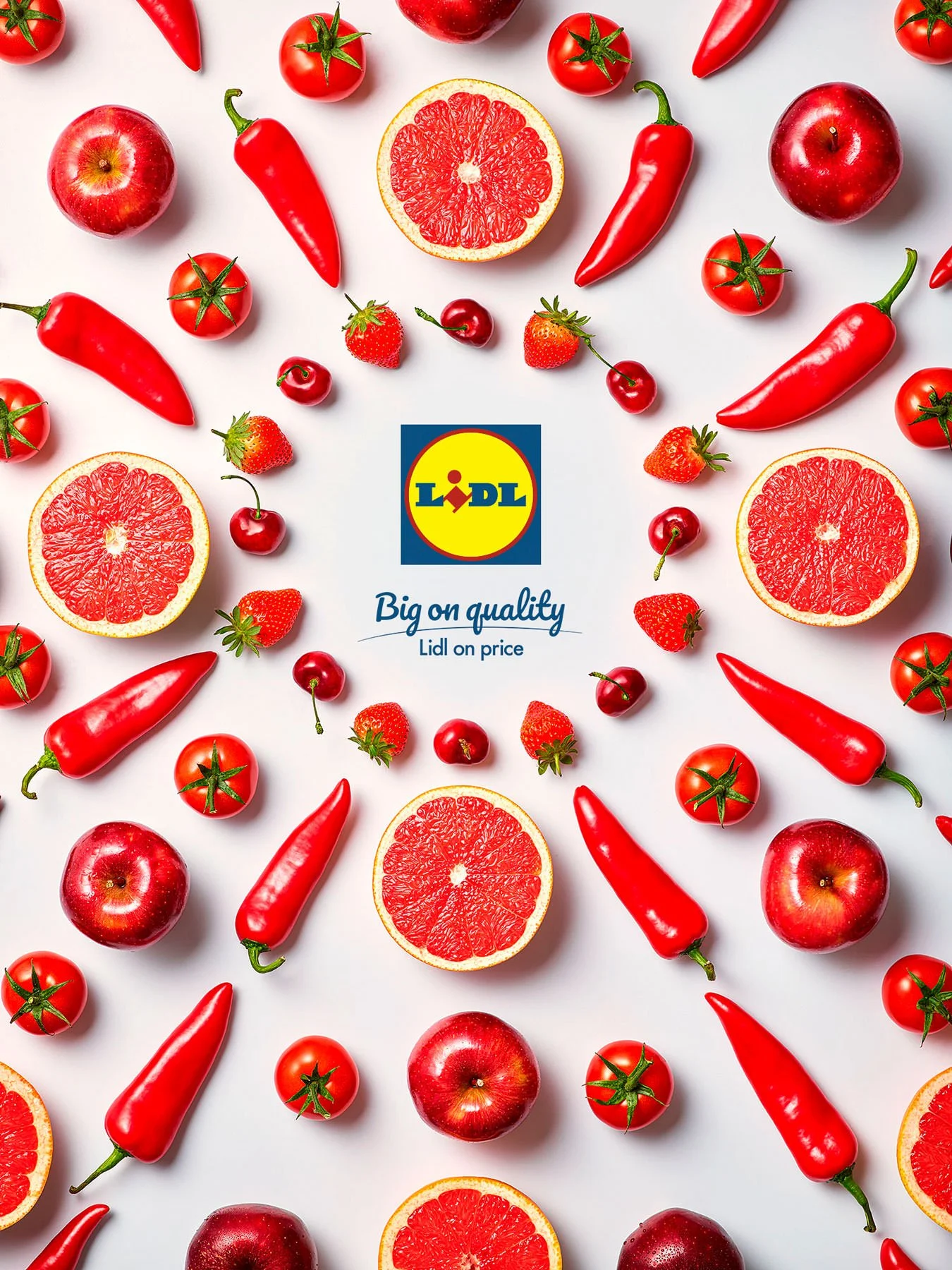 A collection of red fruits including tomatoes, strawberries, cherries, and red bell peppers surrounding a Lidl logo on a white background.