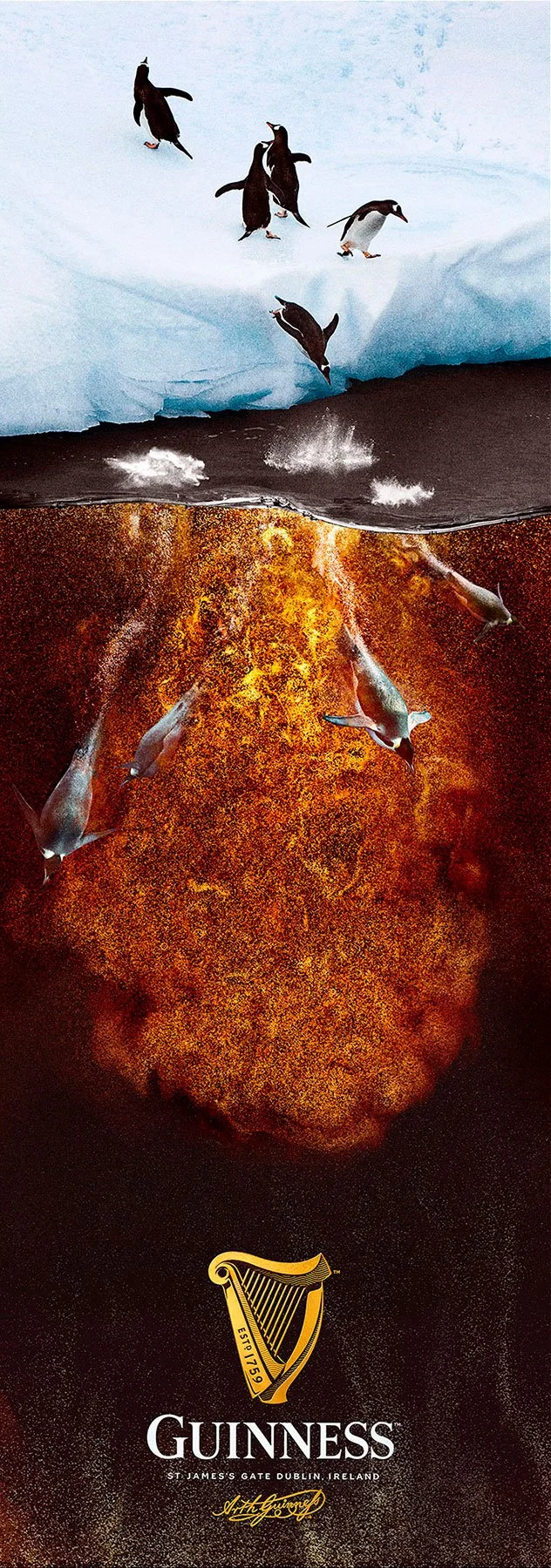 Penguins jumping from ice into water with an erupting volcano below, with the Guinness logo and text at the bottom.