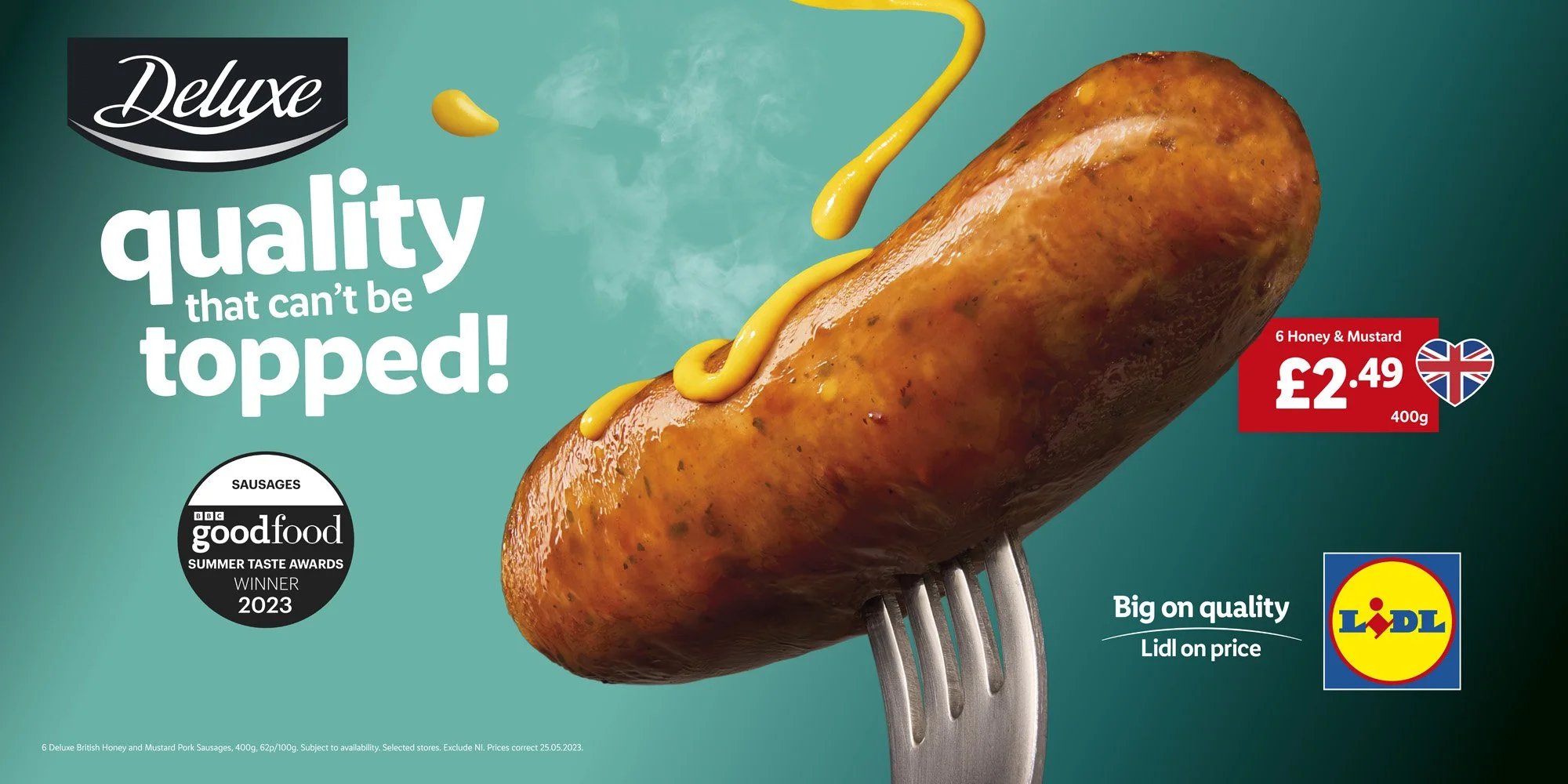 Close-up of a cooked pork sausage with mustard on it, skewered on a fork, against a teal background with text promoting quality sausages for Lidl.