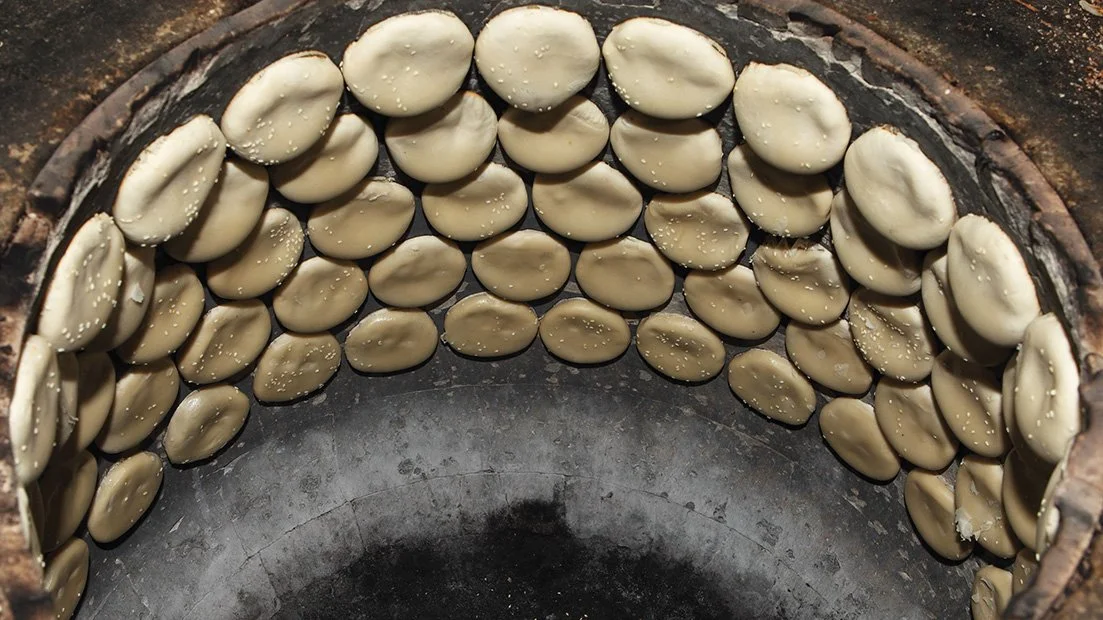 Traditional Hong Peah biscuits being baked in a traditional oven, showing texture