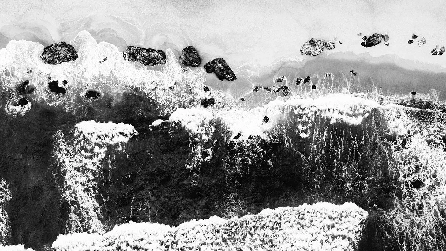 Aerial monochrome photograph of waves breaking along Kemasik beach, Malaysia, emphasizing rhythm, repetition, and contrast.