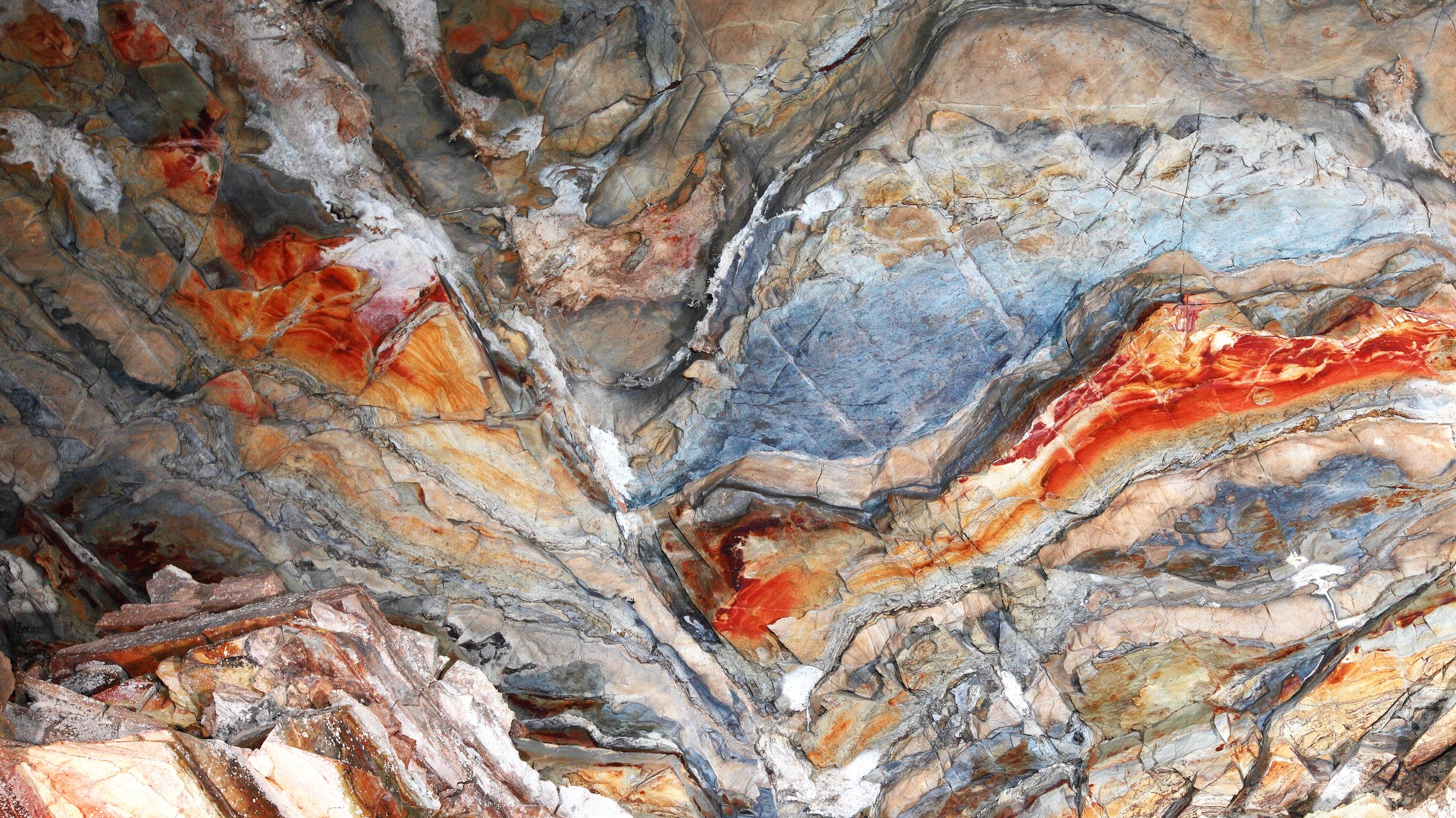 Close-up of cave formations showing layered surfaces and natural erosion patterns.