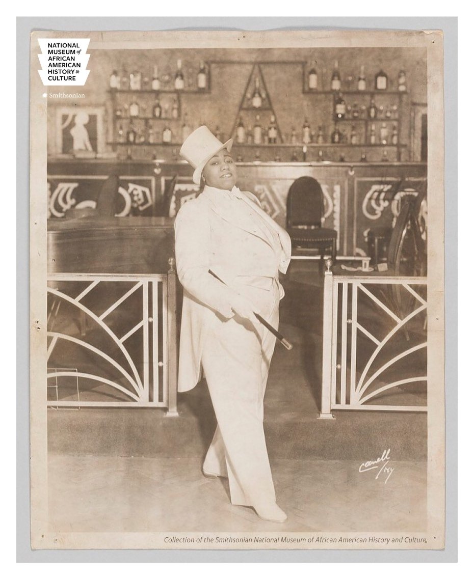 Photo of Gladys Bentley wearing a white tuxedo in a photograph from the Smithsonian Museum.