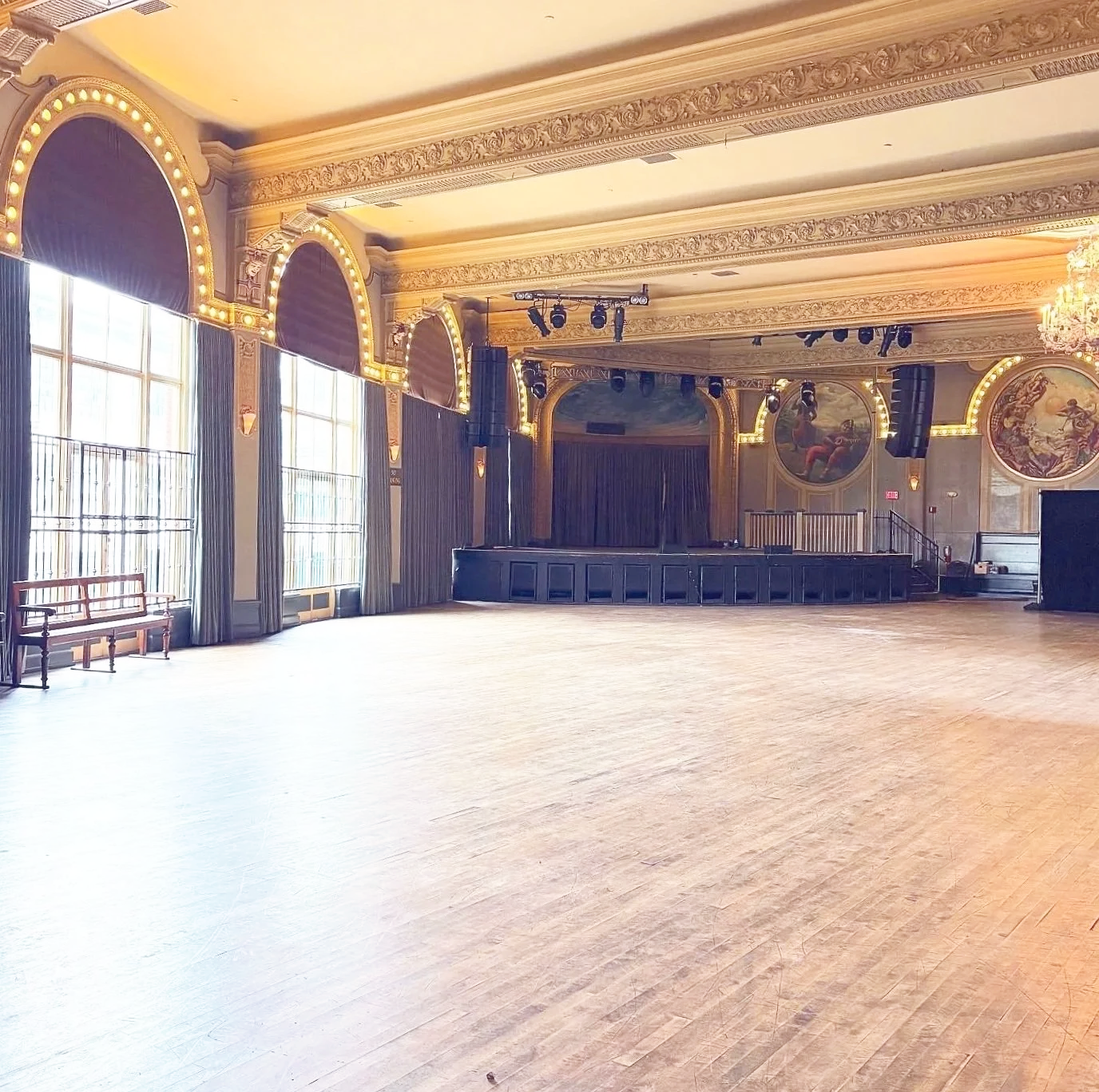 A view from the entrace of Crystal Ballroom in Portland, Oregon. This is where Muse Behavior Fashion Show will take place. It's a decorative ballroom of mostly gold and has floor to ceiling windows.