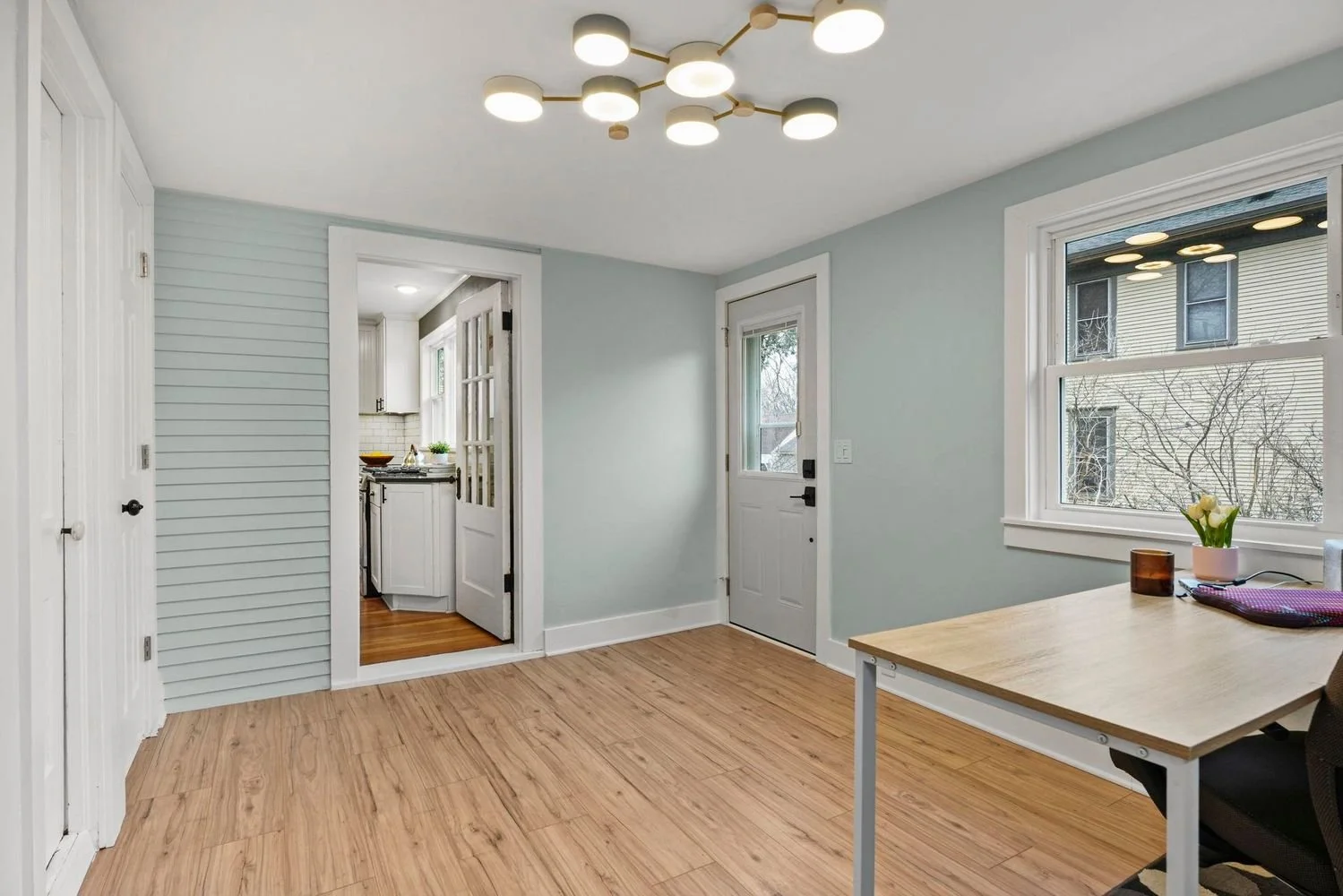 Open-concept interior living space renovation by Root Down Remodeling maximizing historic layout functionality.