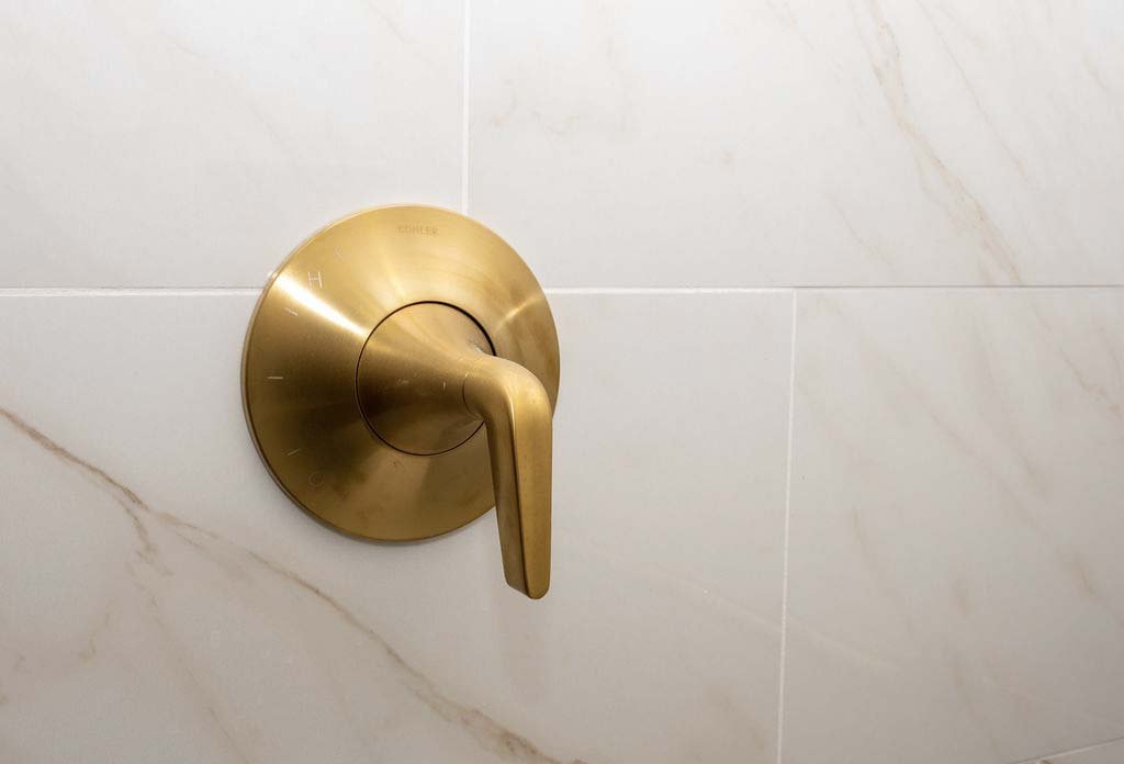 root-down-remodeling-bathroom-remodel-close-up-of-gold-handle.jpg