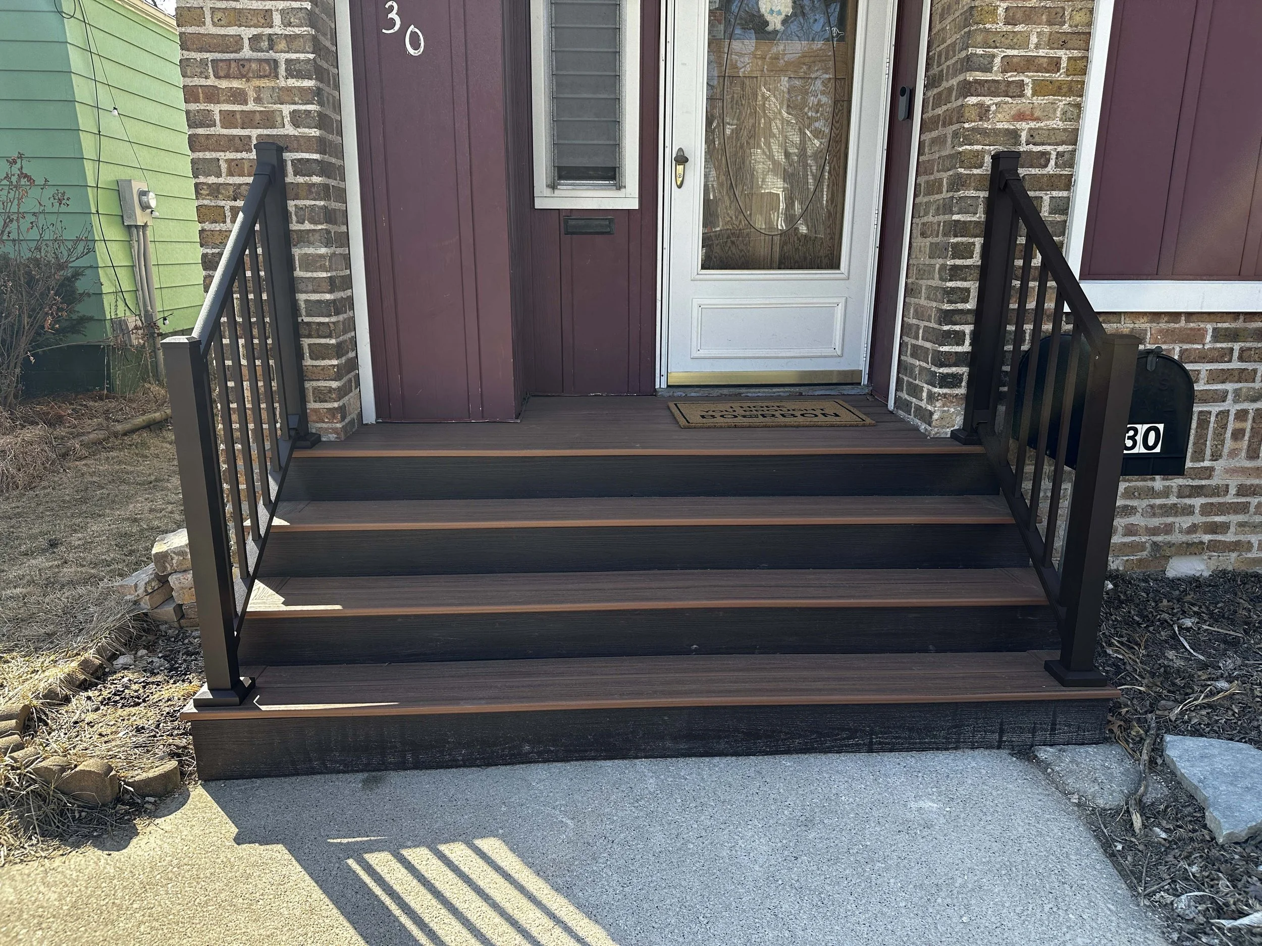 root-down-remodeling-front-porch-brown-wooden-staircase-and-porch.jpg