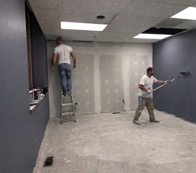Professionals renovating an office environment, drywall and painting