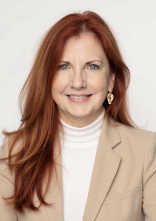 Professional headshot image of Indigo Office Furniture and Design Owner Nora Shaw