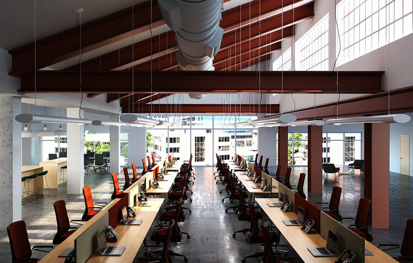 Modern office conference room with long desks, ergonomic chairs, and desktop phones, featuring large windows and high ceilings with exposed ductwork.