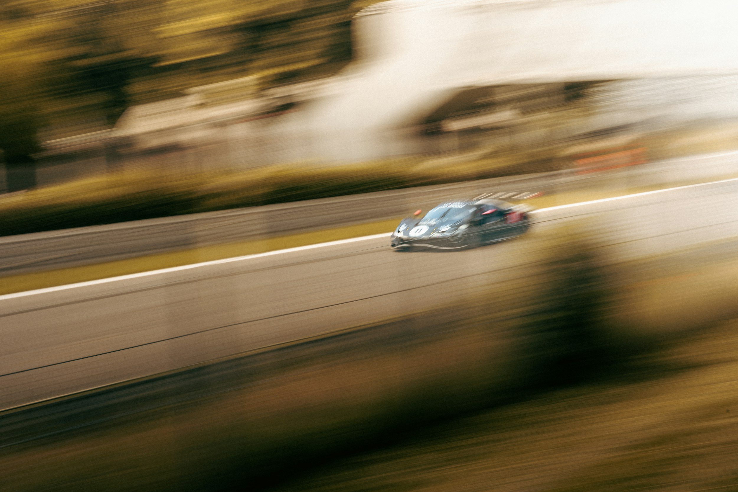 Race car speeding by and it's blurry