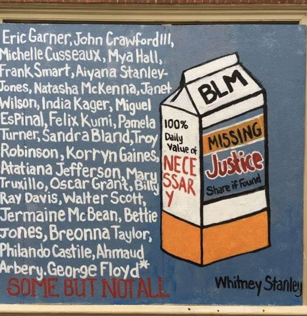 A blue poster features a list of names and a graphic of a milk carton with the words "BLM," "MISSING," and "Justice". The poster notes "100% Daily Value of NECE SSARY" and "Share if Found." The bottom of the poster reads "SOME BUT NOT ALL" and is signed by Whitney Stanley.