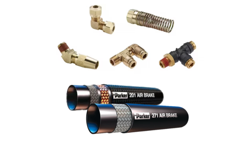 Collection of brass and metal fittings, connectors, and hoses for air brake system, including two Parker air brake hoses.