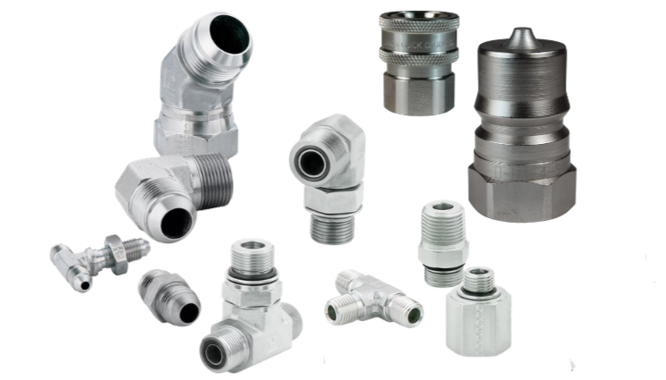 Collection of metal pneumatic and hydraulic fittings and adapters on a white background.