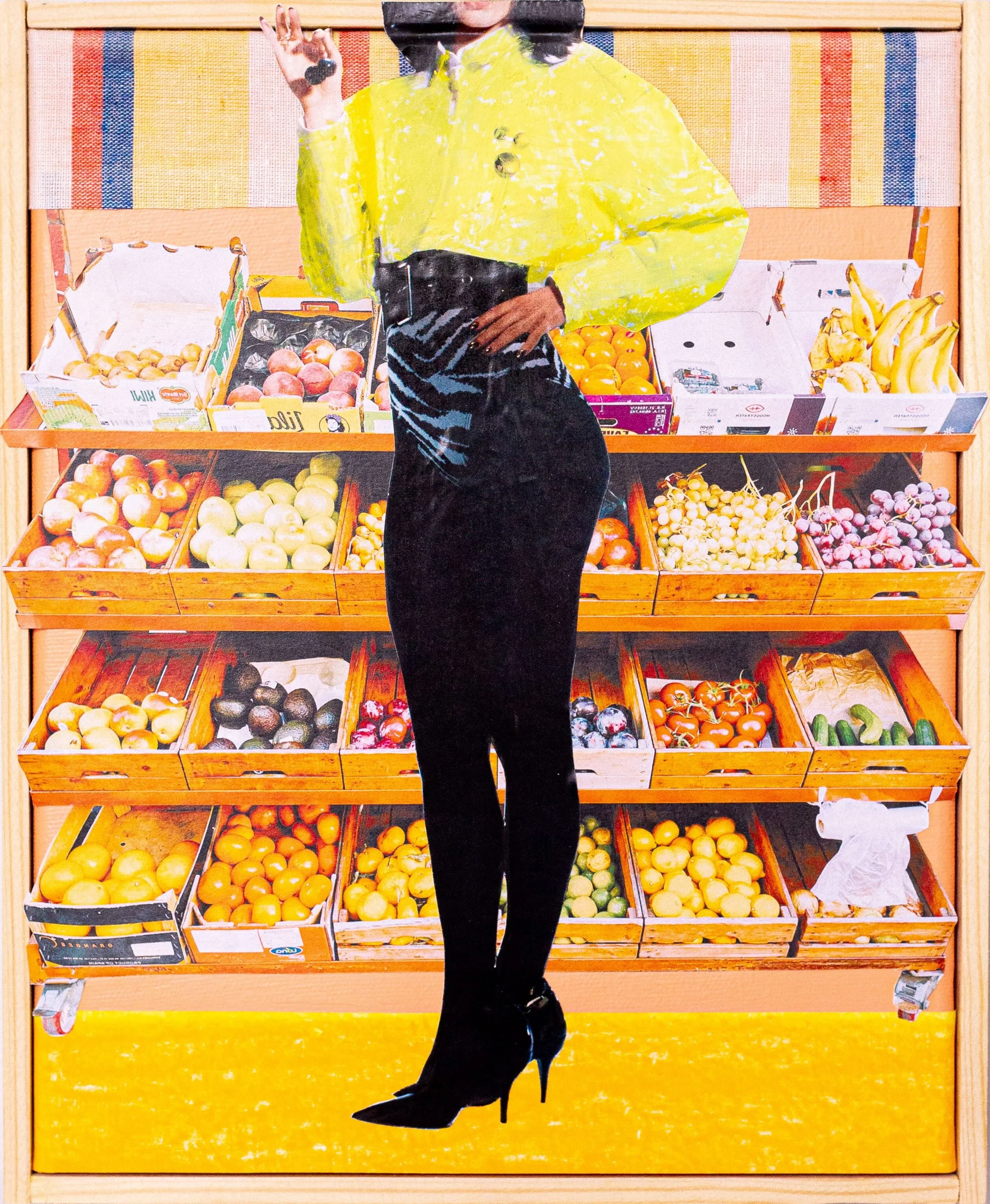 A woman in a neon yellow jacket and high-heeled black boots standing in front of a display of fresh fruit at a grocery store, holding a black object.