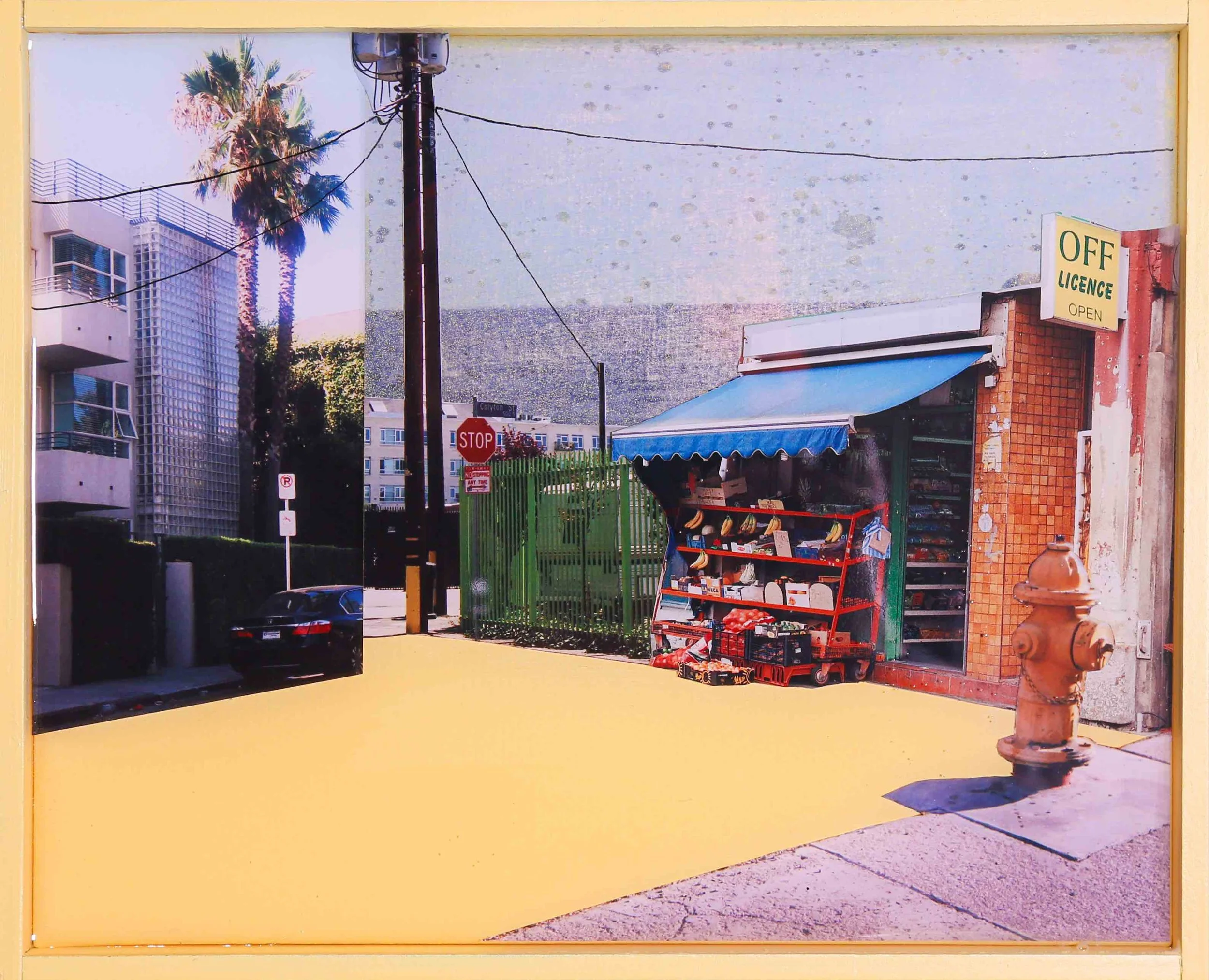 A street scene showing a small storefront with a blue awning selling produce, a fire hydrant, a stop sign, and a street sign at a corner with tall buildings and a palm tree in the background. Artwork by British artist, Harry Cartwright