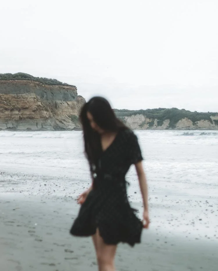 woman walking on a beach