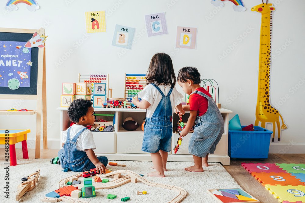 Children playing together with toys in a bright and fun childcare space designed to keep kids entertained during events.