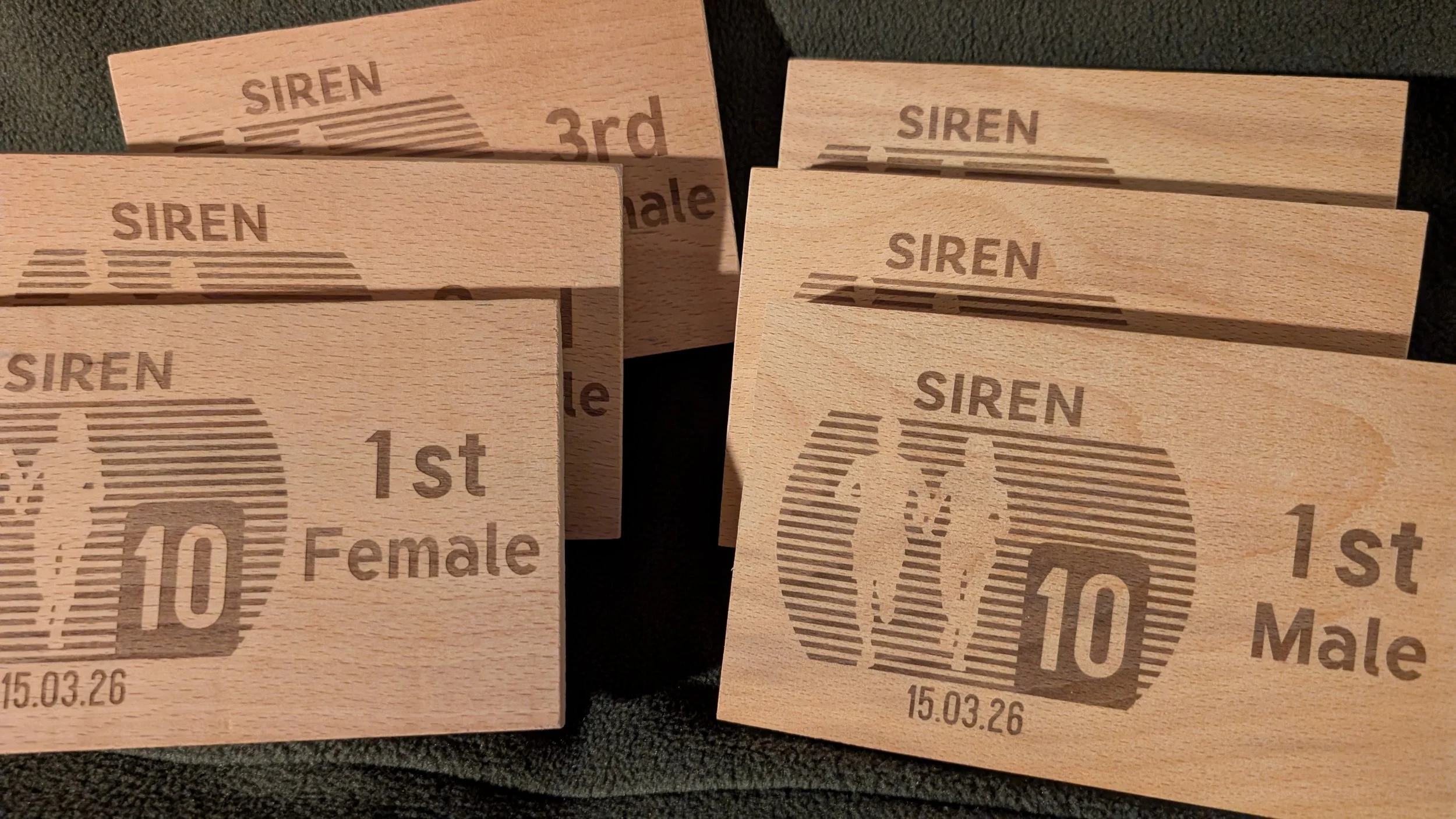 Laser engraved wooden trophies. 