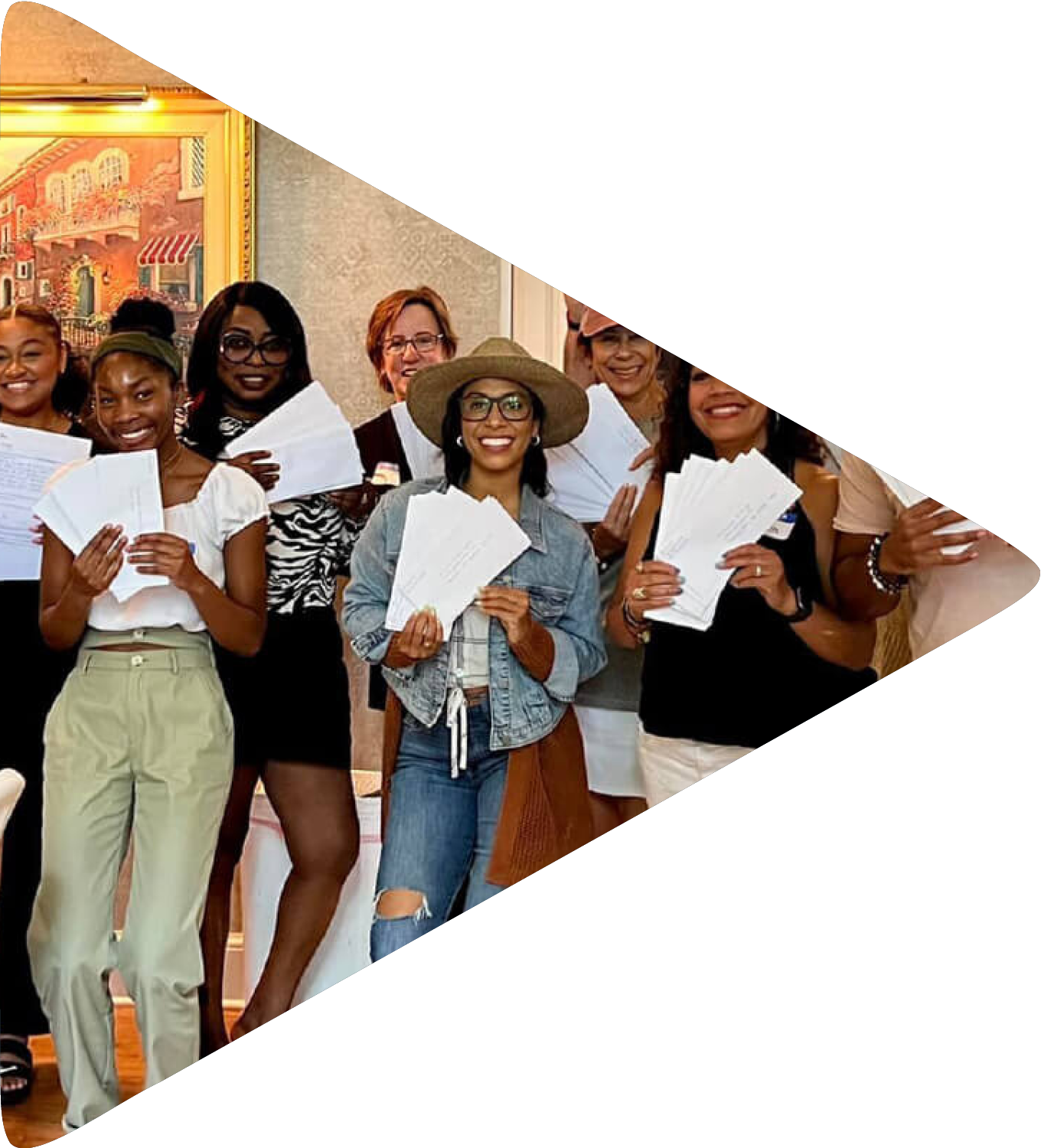 A group of women standing holding letters.