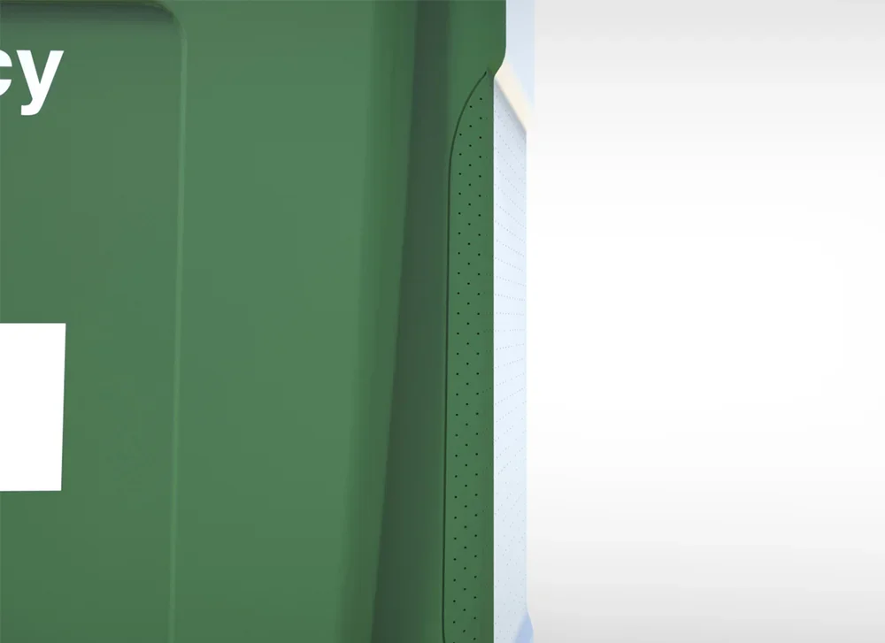 Close-up of a green recycling bin or container with a small white label