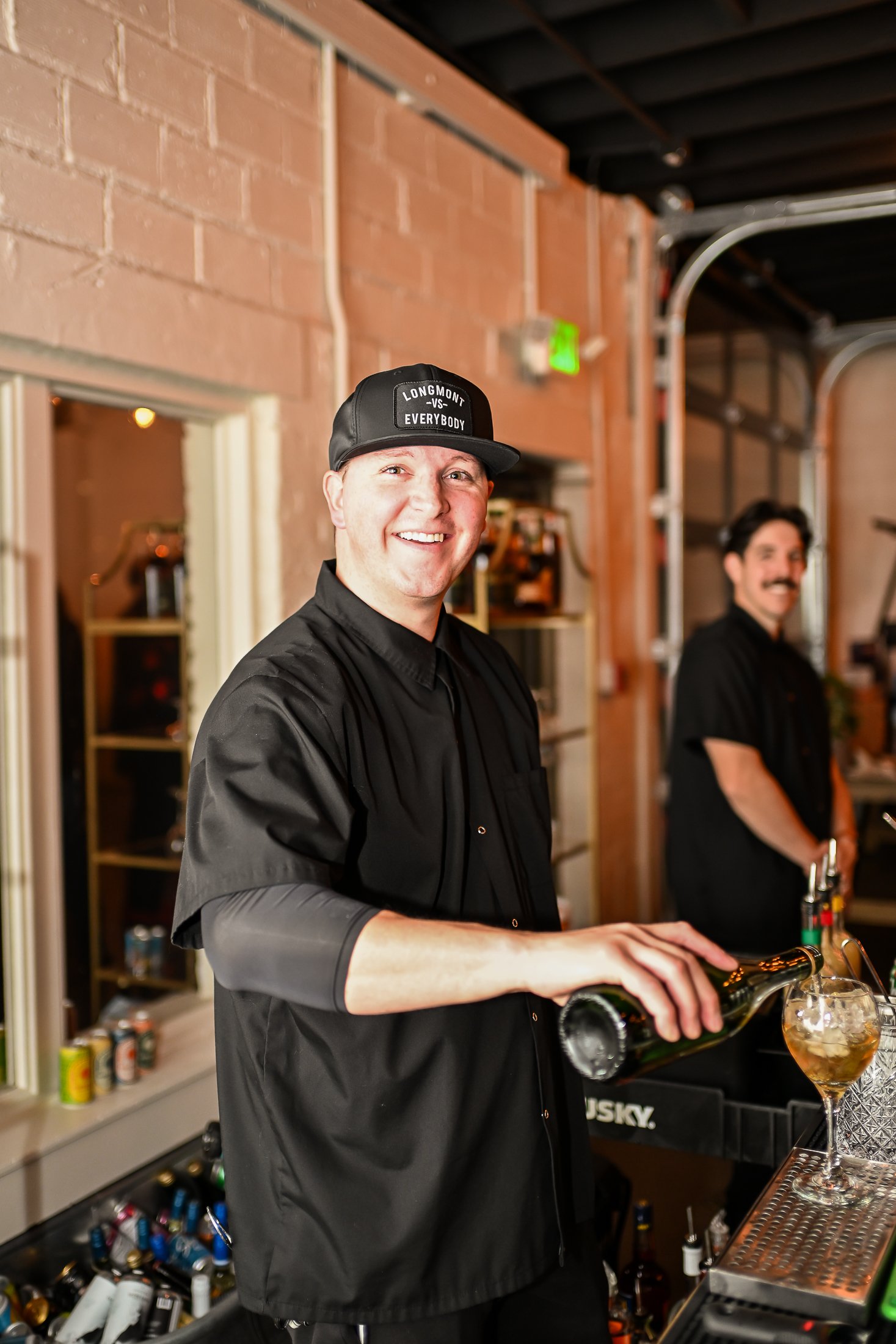 Bartender pouring a drink at an event