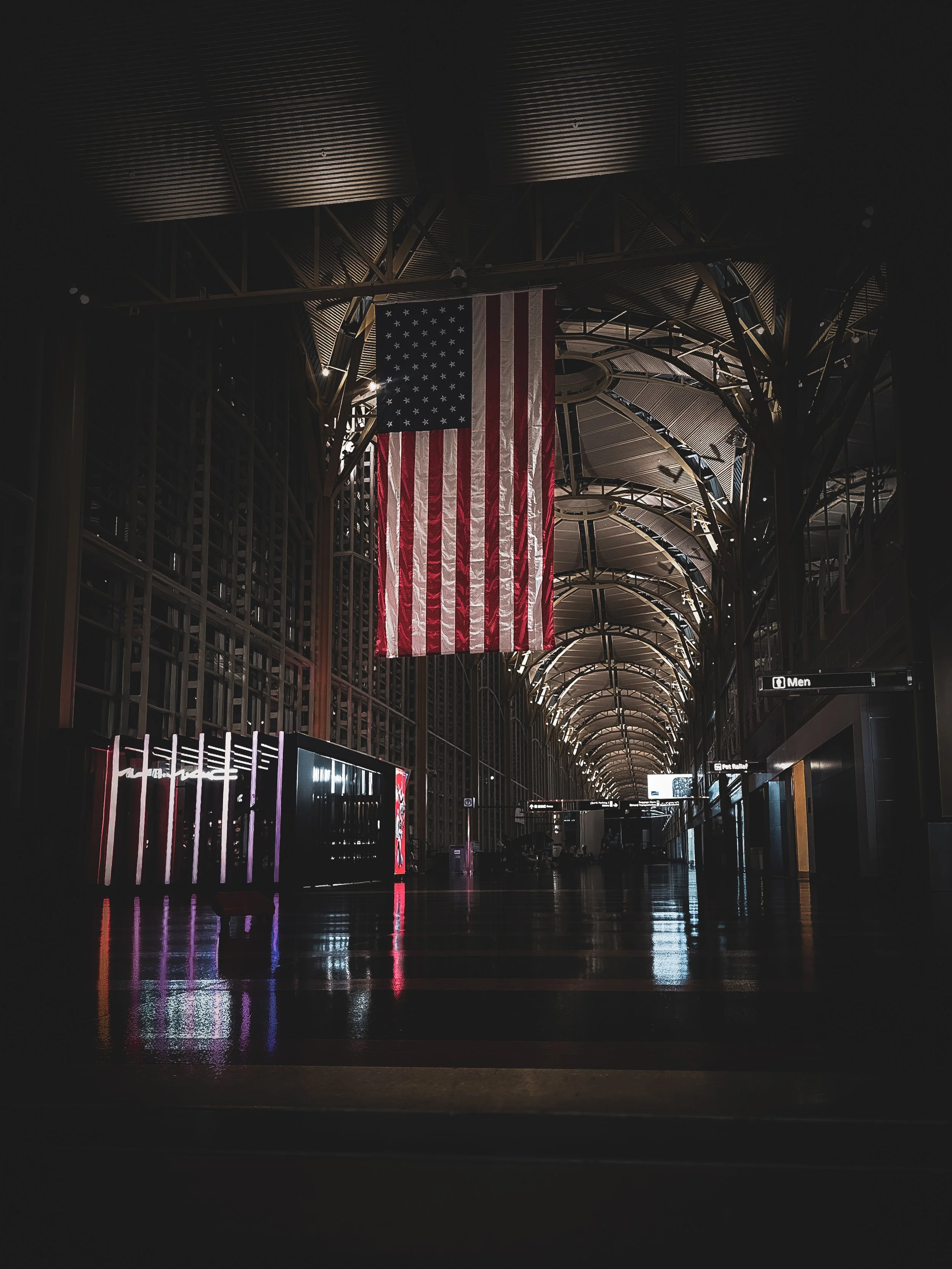 Large American flag hanging inside Ronald Reagan Washington National Airport terminal in Washington DC, photographed by Frederick Maryland fine art photographer Amy Hood