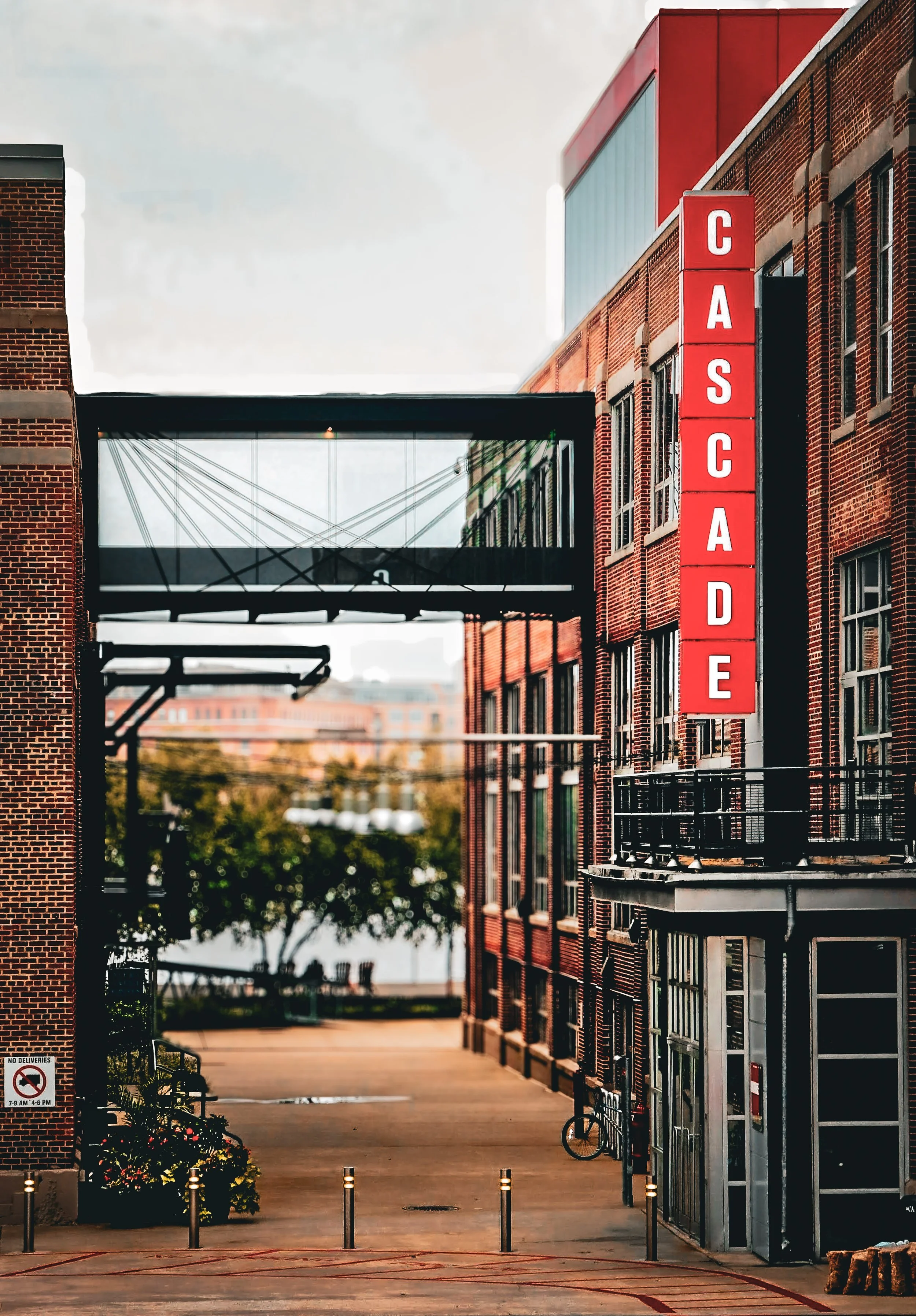 Historic Cascade building framed by warm afternoon light and architectural lines in an urban setting.